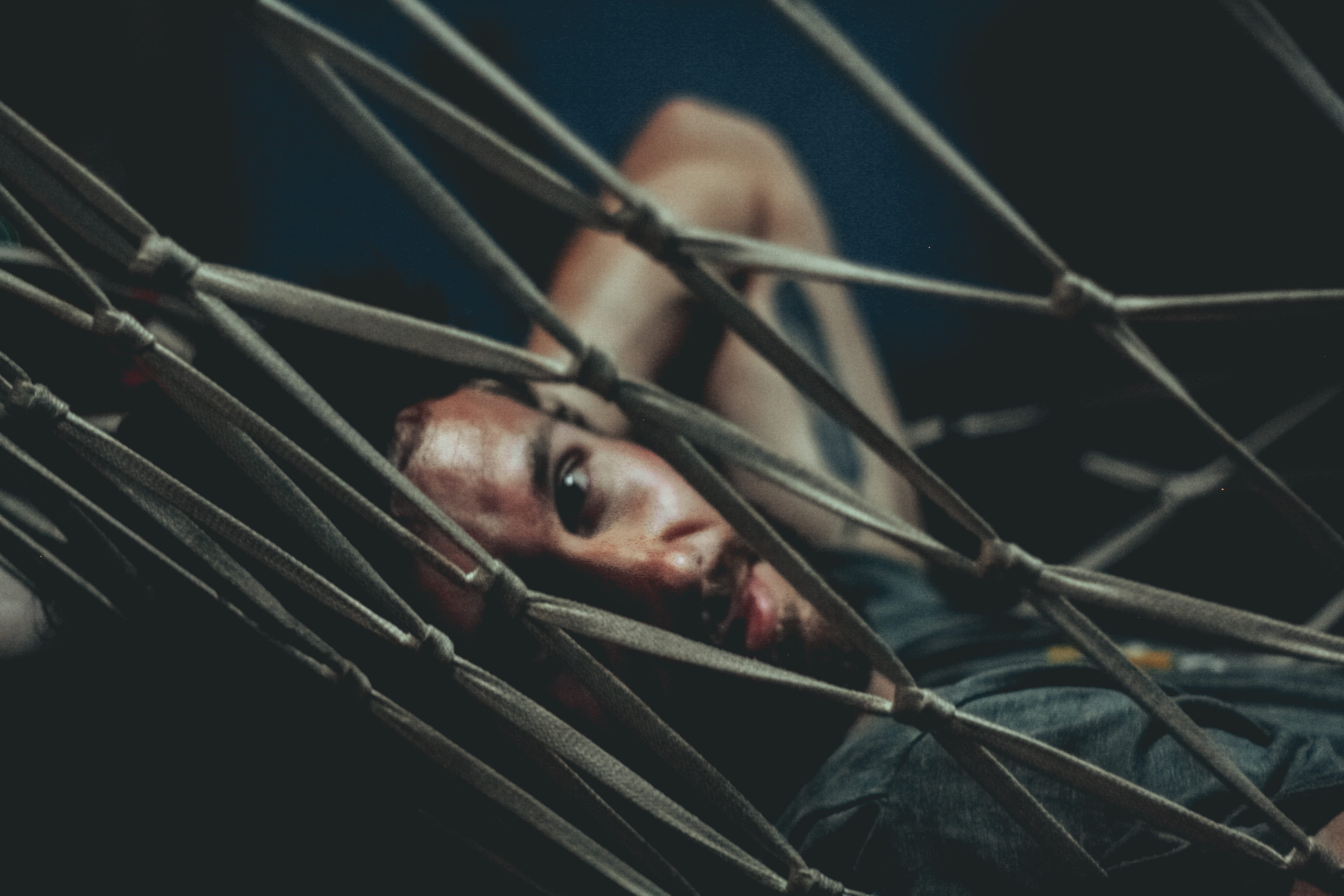 lying down, face, cricket insect, fear, young adult, arrow, symbol, invertebrate, paint container, trapped, real people, bookcase, furniture, hopelessness, HD Wallpaper