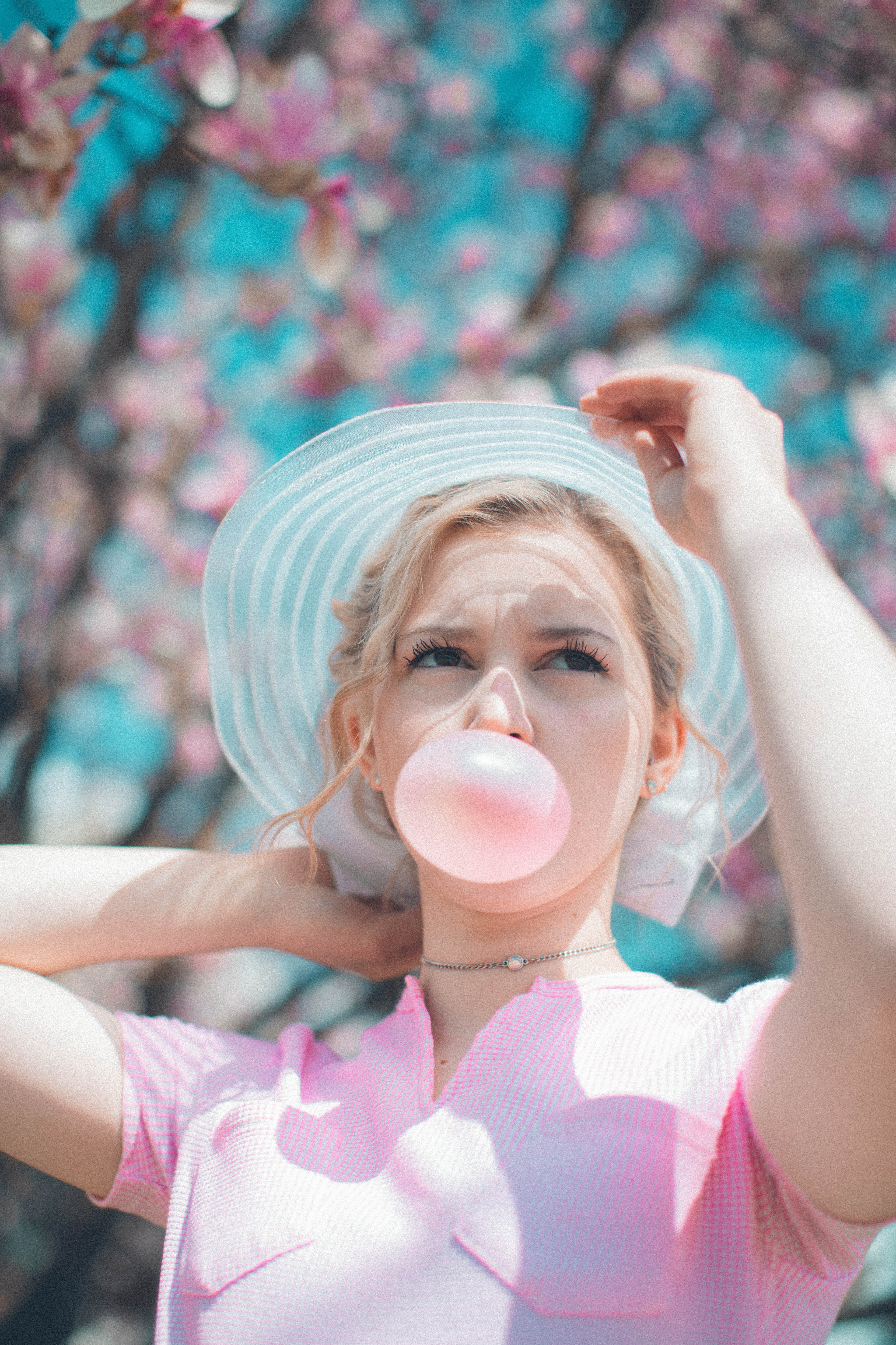blowing, woman, one Person, outdoors, beautiful, chewing, cheerful, gum, focus on foreground, Pop pop, only women, people, limb, caucasian, one woman only, Phone HD Wallpaper