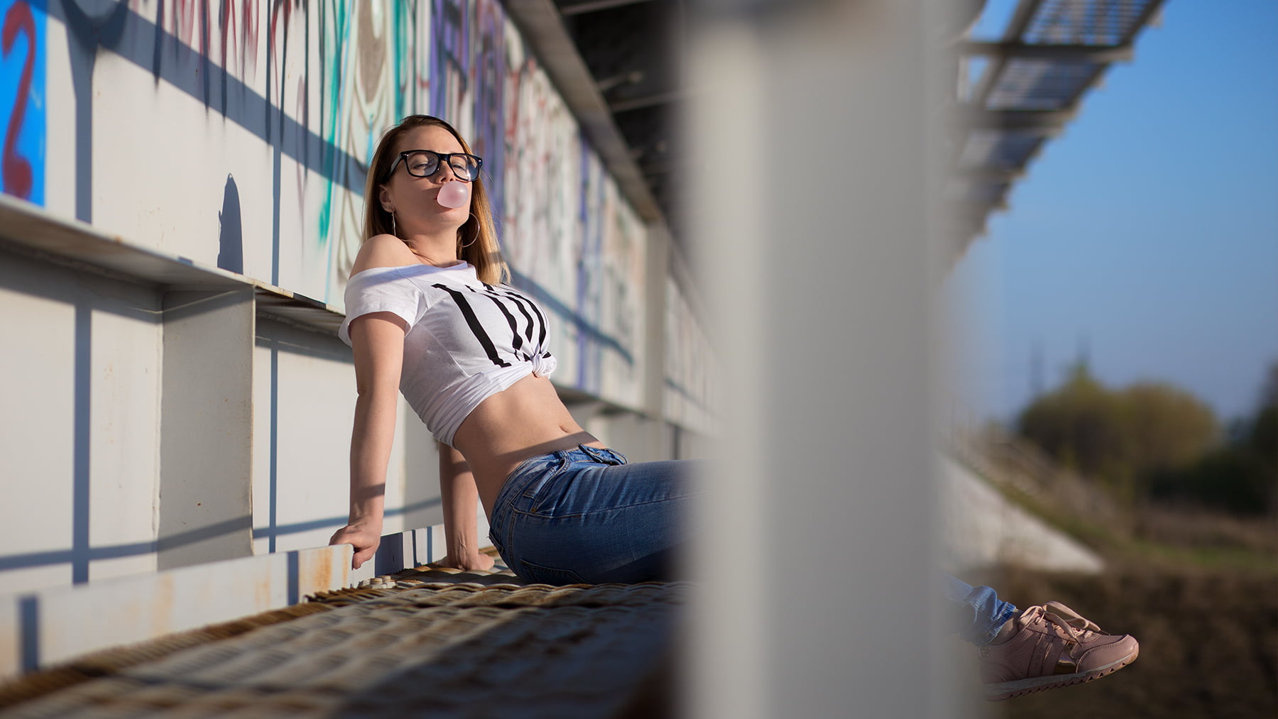 bokeh, T-shirt, women outdoors, sitting, 720P, model, glasses, hoop earrings, looking at viewer, women with glasses, women, sneakers, Aleksey Lozgachev, HD Wallpaper