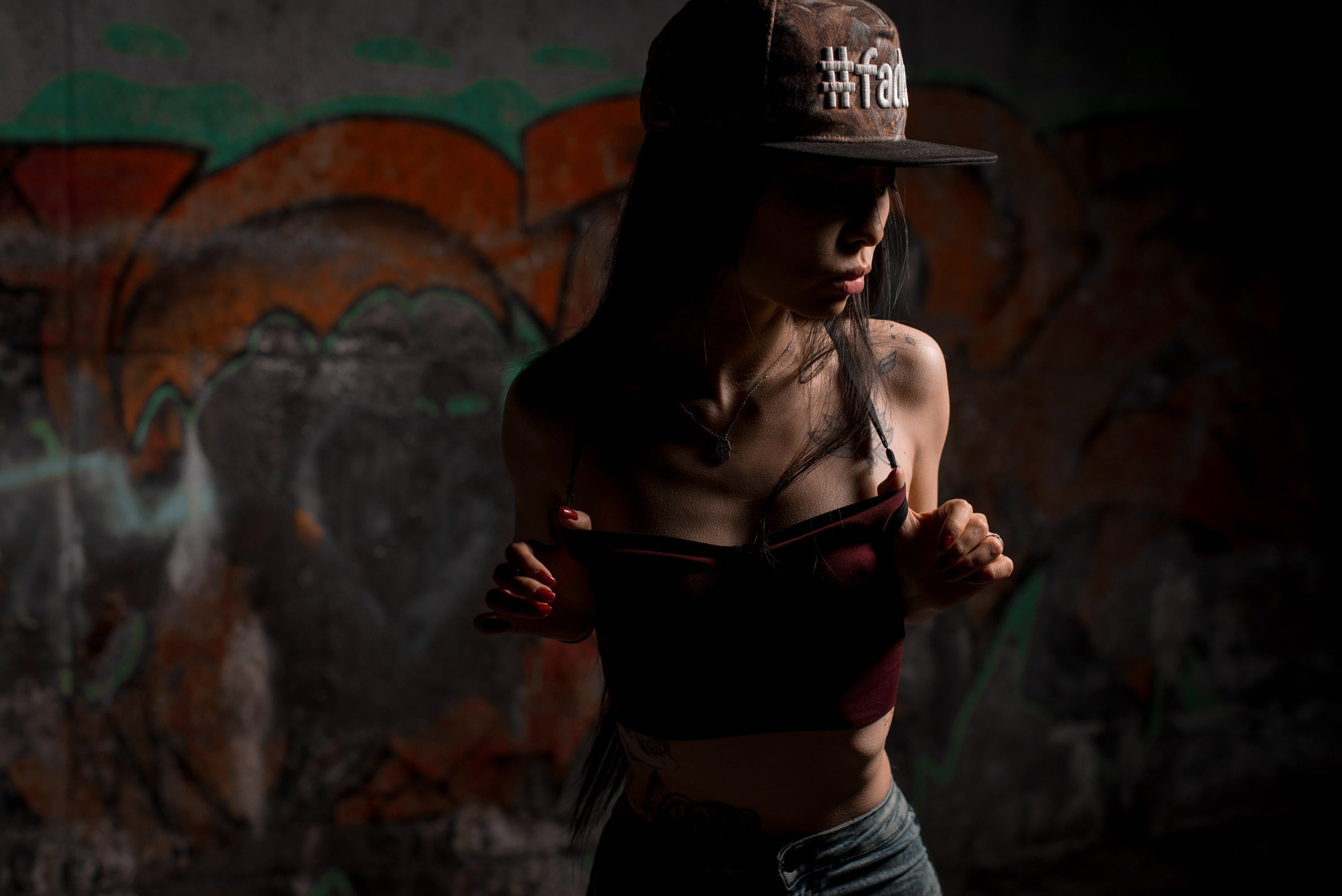 2K, graffiti, wall, brunette, tattoo, model, outdoors, Anton Vladimirovich, women, baseball caps, inked girls, short tops, dark, women outdoors, necklace, HD Wallpaper