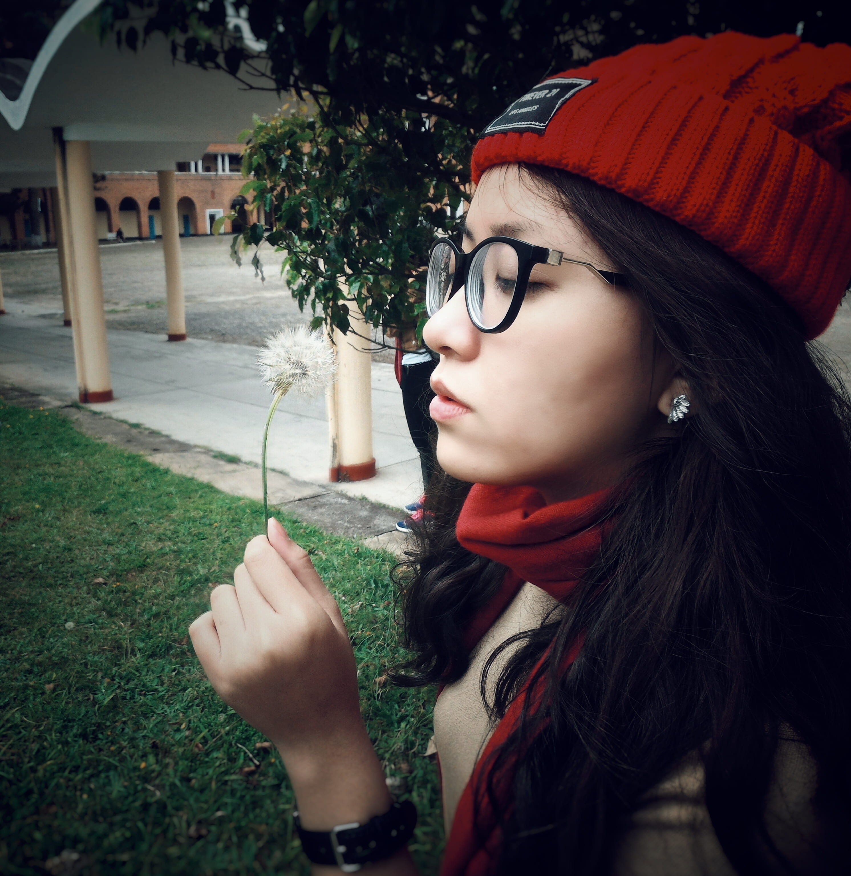headshot, smile, front view, holding, eyeglasses, person, red, pose, women, beanie, outdoors, model, street, looking, daylight, 2K, woman, eyewear, hand, Phone HD Wallpaper