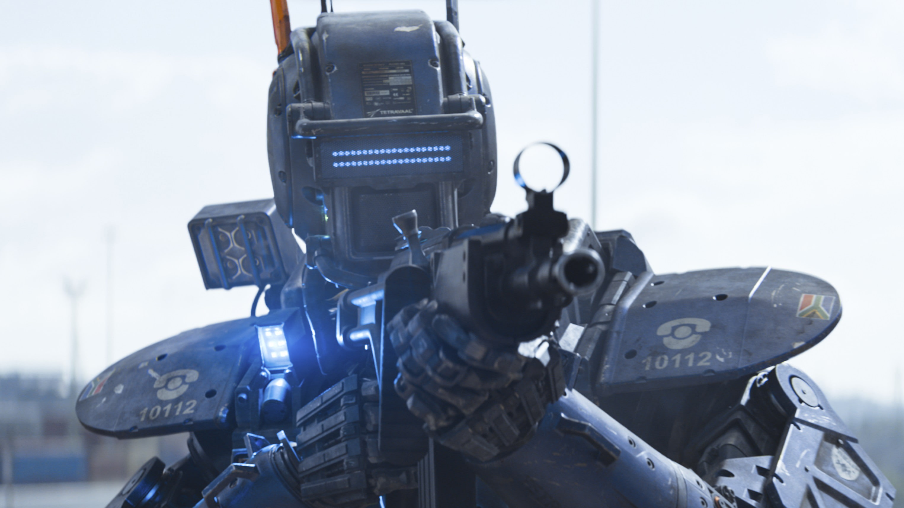government, 2K, nature, Chappie, holding, gun, rifle, weapon, military, security, camera - photographic equipment, photography themes, day, headwear, robot, HD Wallpaper