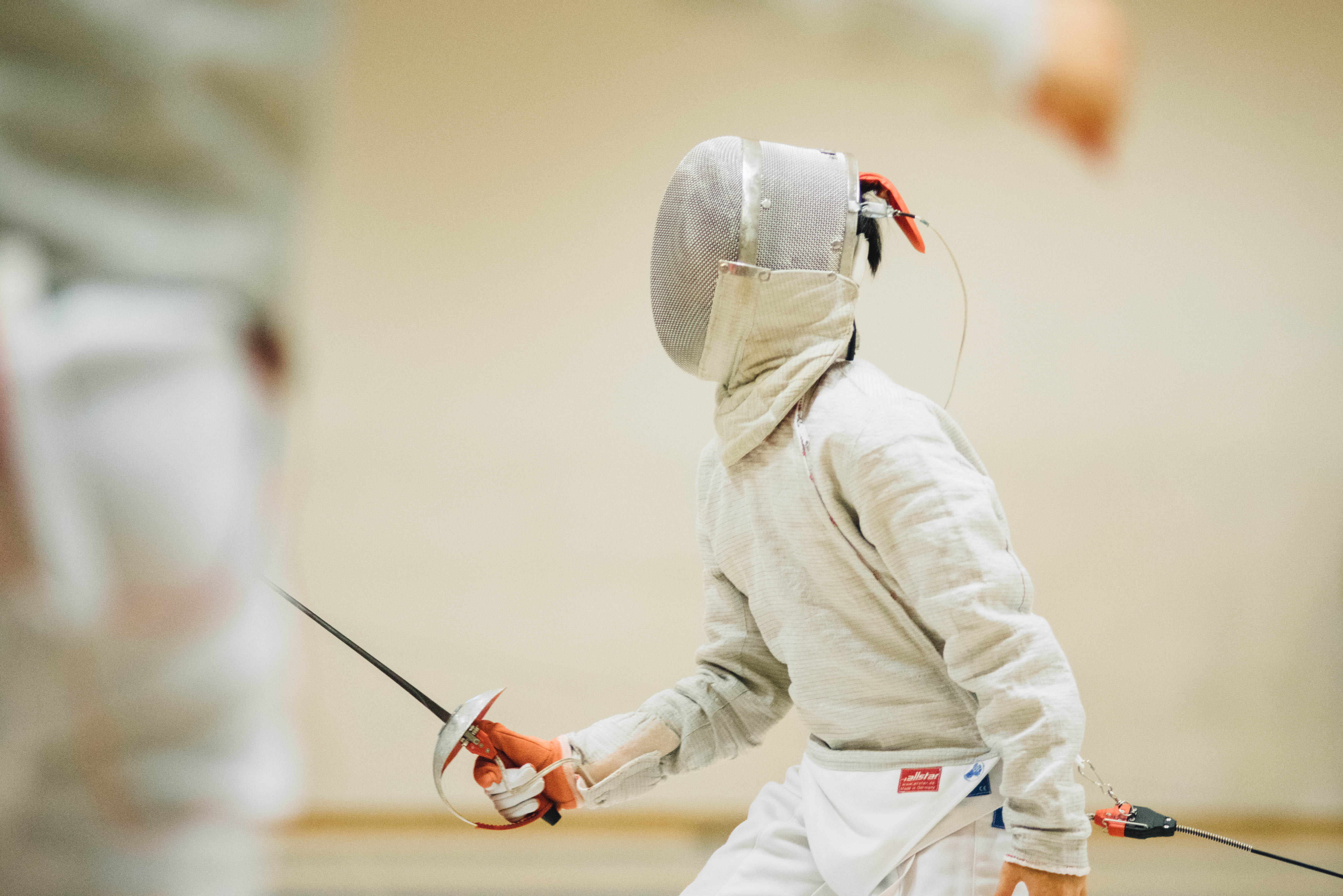 side view, vest, black, person, white, hood - clothing, waist up, technology, fencing, selective focus, standing, holding, men, inside, one person, HD Wallpaper