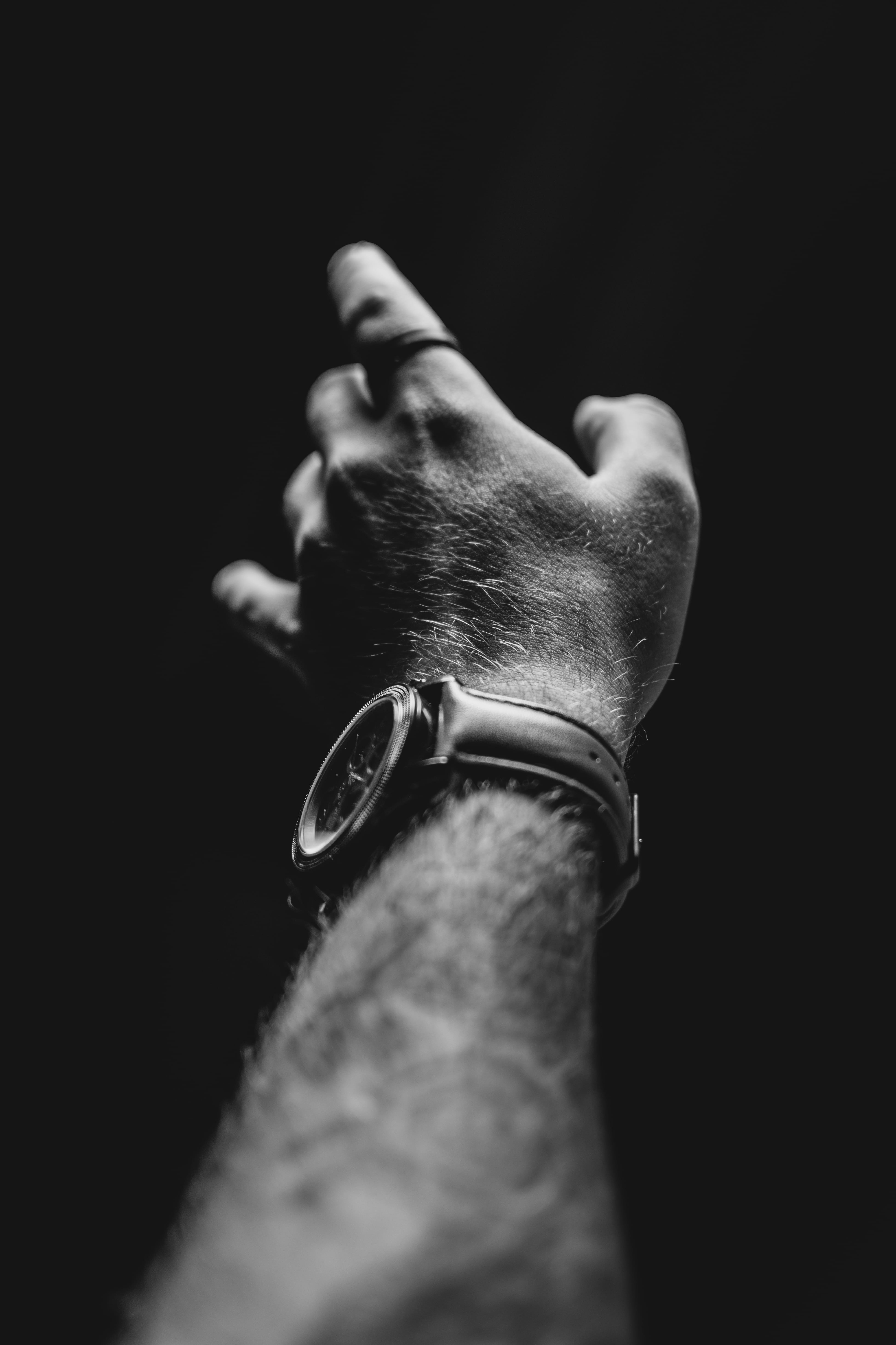 studio shot, and, reach, emotion, hand, one person, real people, hair, expressmen, 5K, black background, fashion, human body part, person, black and white, Phone HD Wallpaper