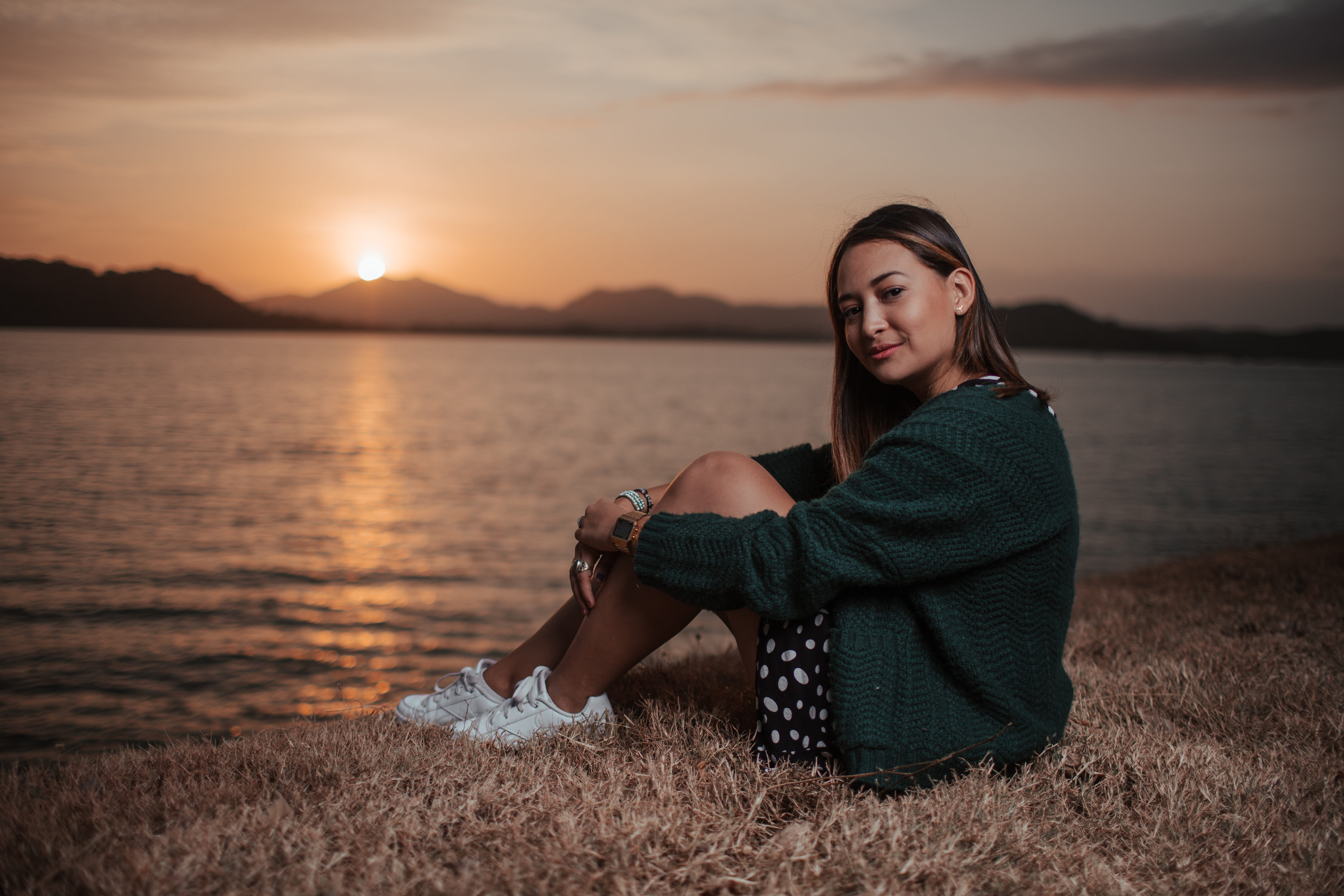 sun, sky, evening, model, ocean, seascape, hairstyle, scenic, golden hour, clouds, female, grass, adult, sitting, young adult, young women, lake, lifestyles, HD Wallpaper