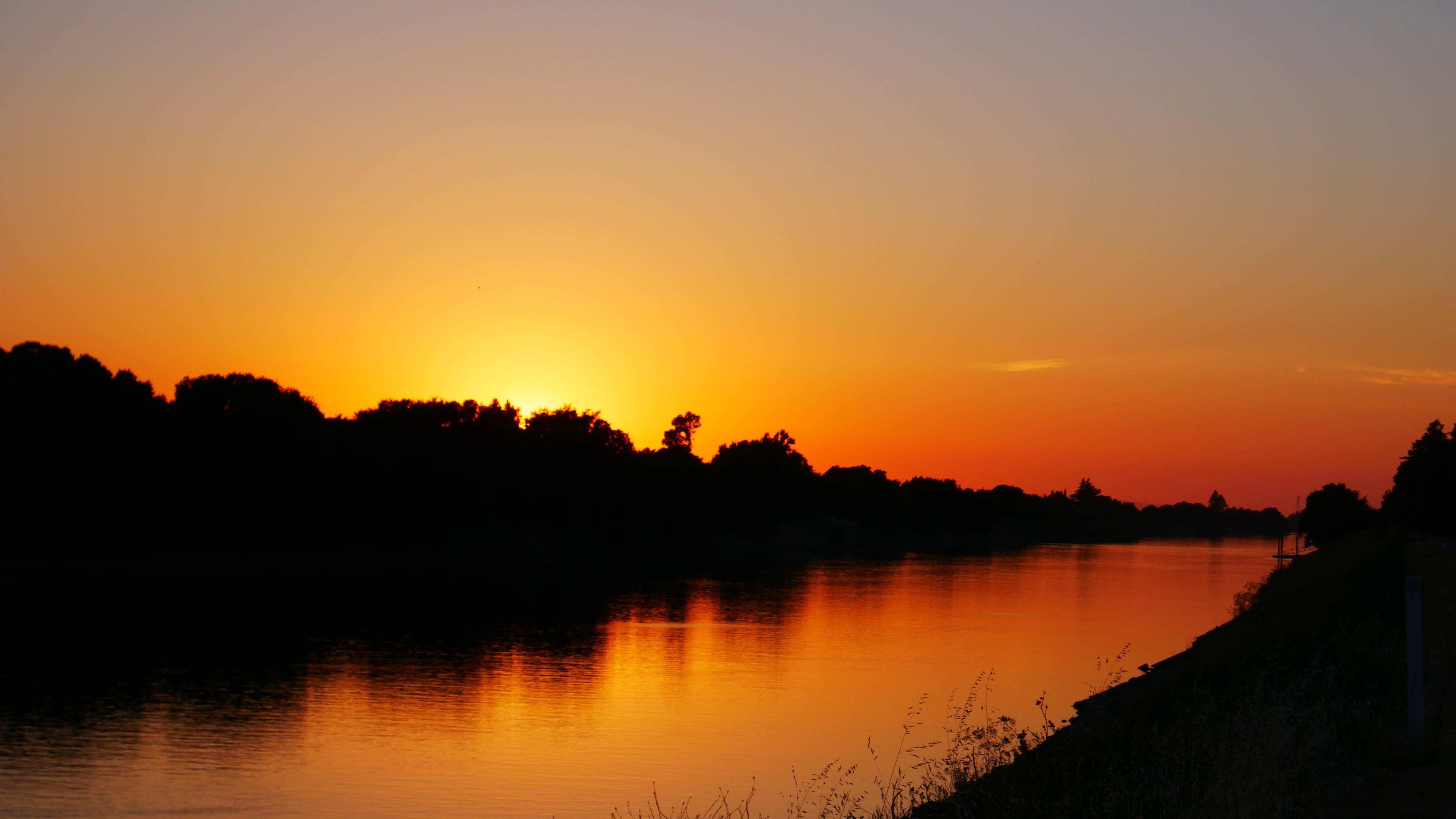 orange color, sky, silhouette, non-urban scene, no people, 4K, tranquil scene, plant, scenics - nature, reflection, nature, sunset, romantic sky, water, HD Wallpaper