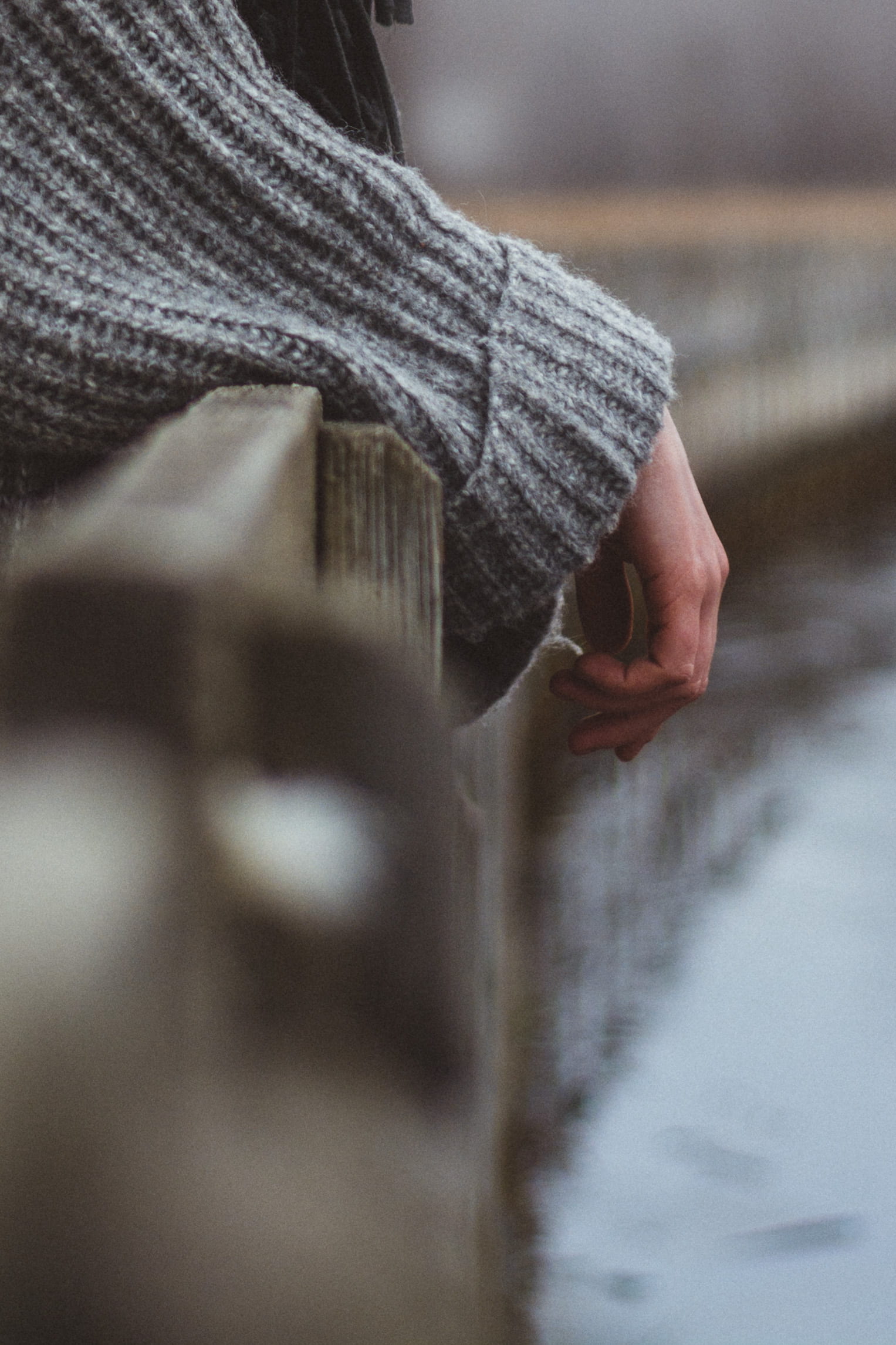human hand, photography, selective focus, sweater, textile, human body part, finger, midsection, outdoors, fence, warm clothing, unrecognizable person, Phone HD Wallpaper