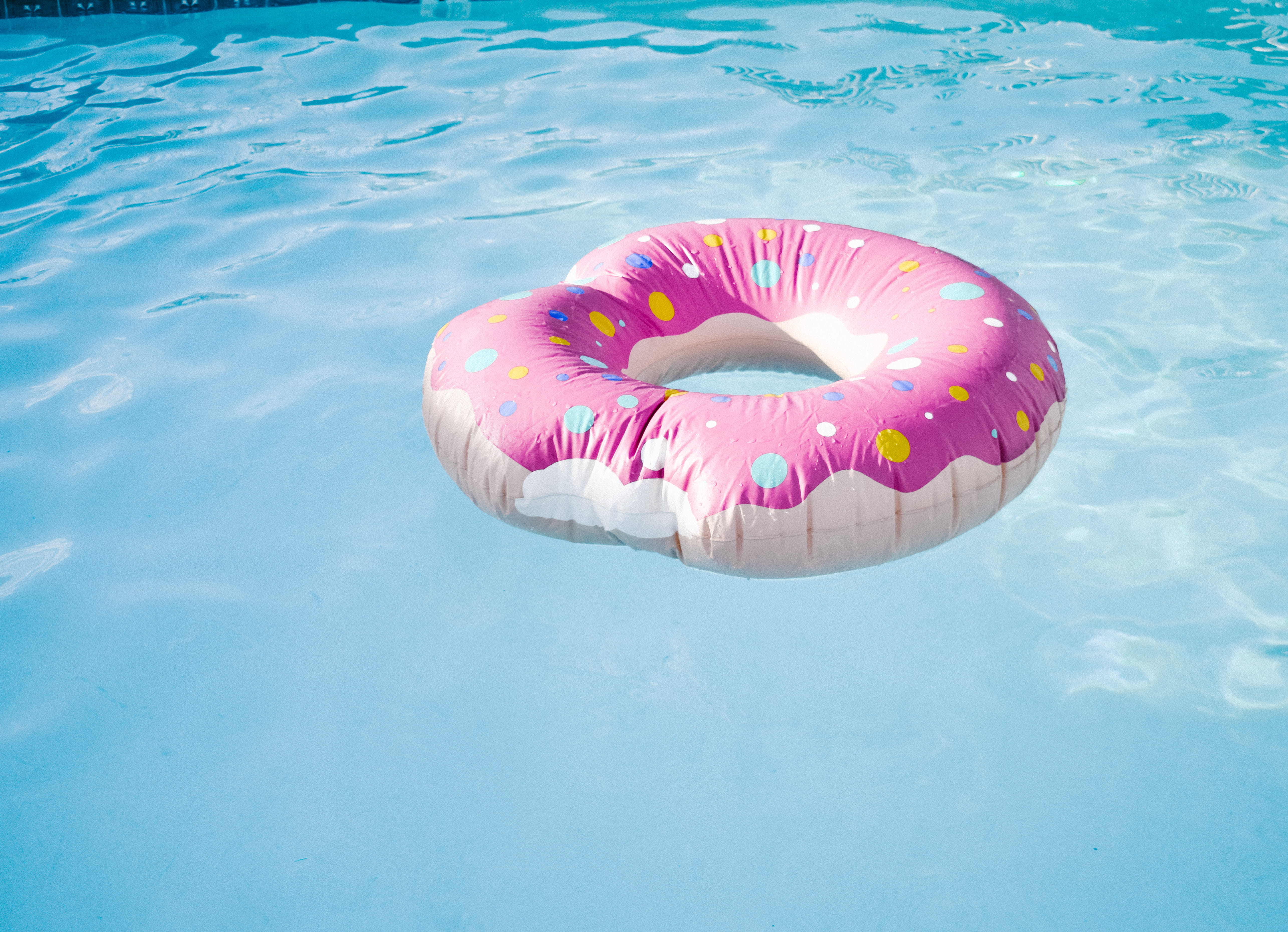floating, no people, multi colored, floating on water, close-up, 5K, coated, outdoors, blue, nature, floater, water, swimming pool, inflatable, sunlight, HD Wallpaper