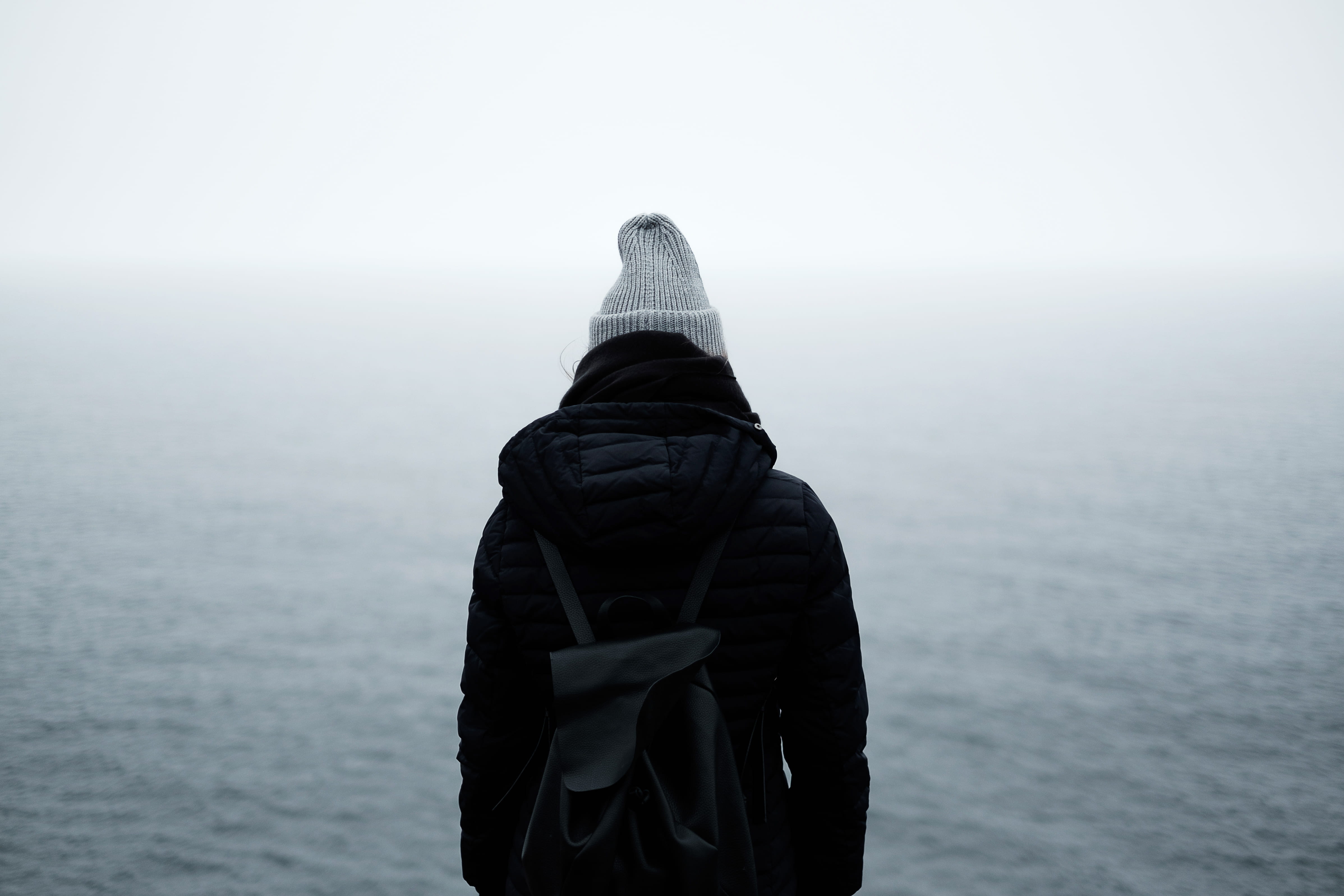 standing, one person, back, ocean, outdoors, nature, black, scenics - nature, clothing, quiet, hood, day, backpack, hood - clothing, trip, sea, body, warm clothing, HD Wallpaper