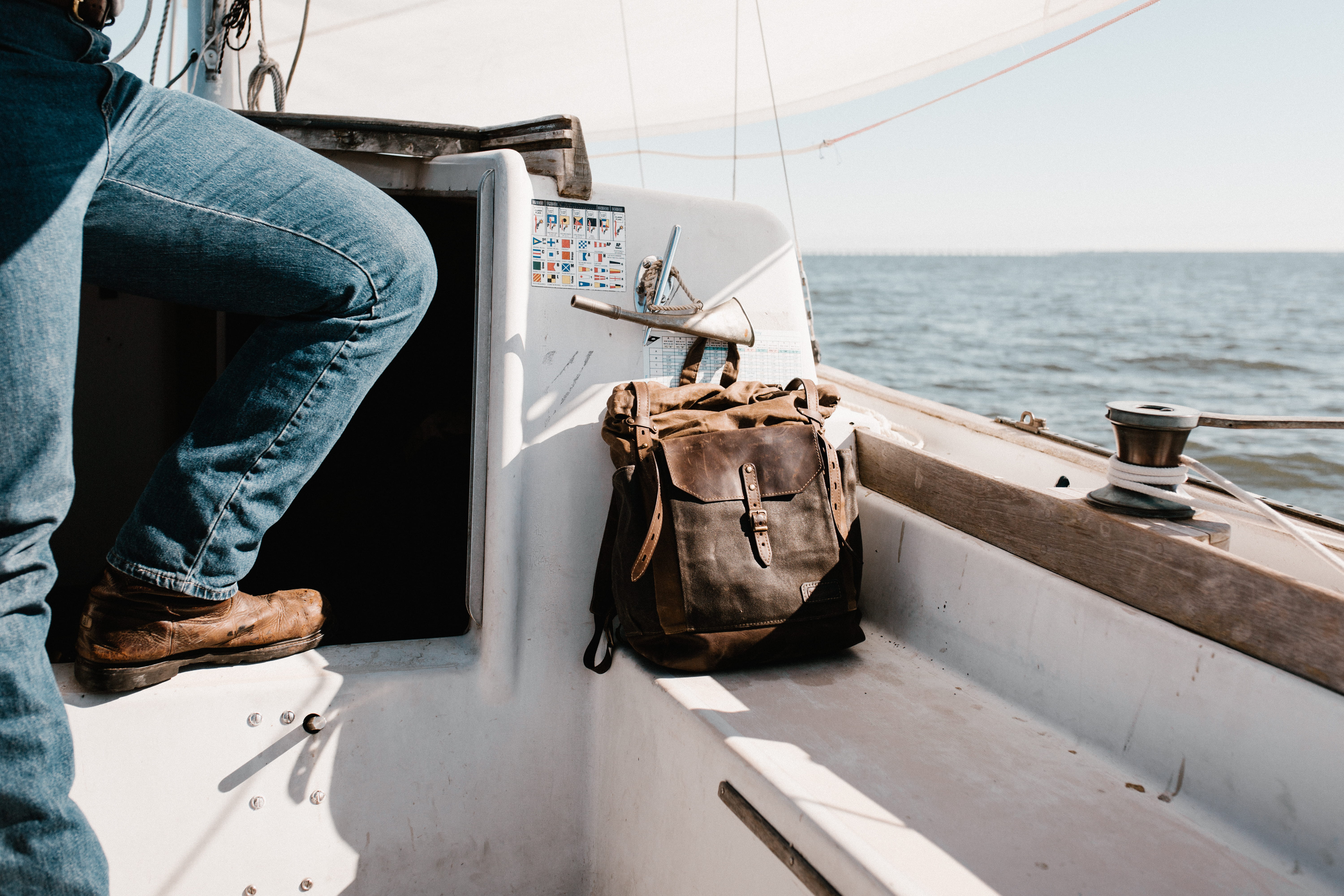 men, boat Deck, leather, knapsack, water, 5K, day, leisure activity, white, people, yacht, mode of transportation, nature, lifestyles, sailing Ship, nautical Vessel, HD Wallpaper