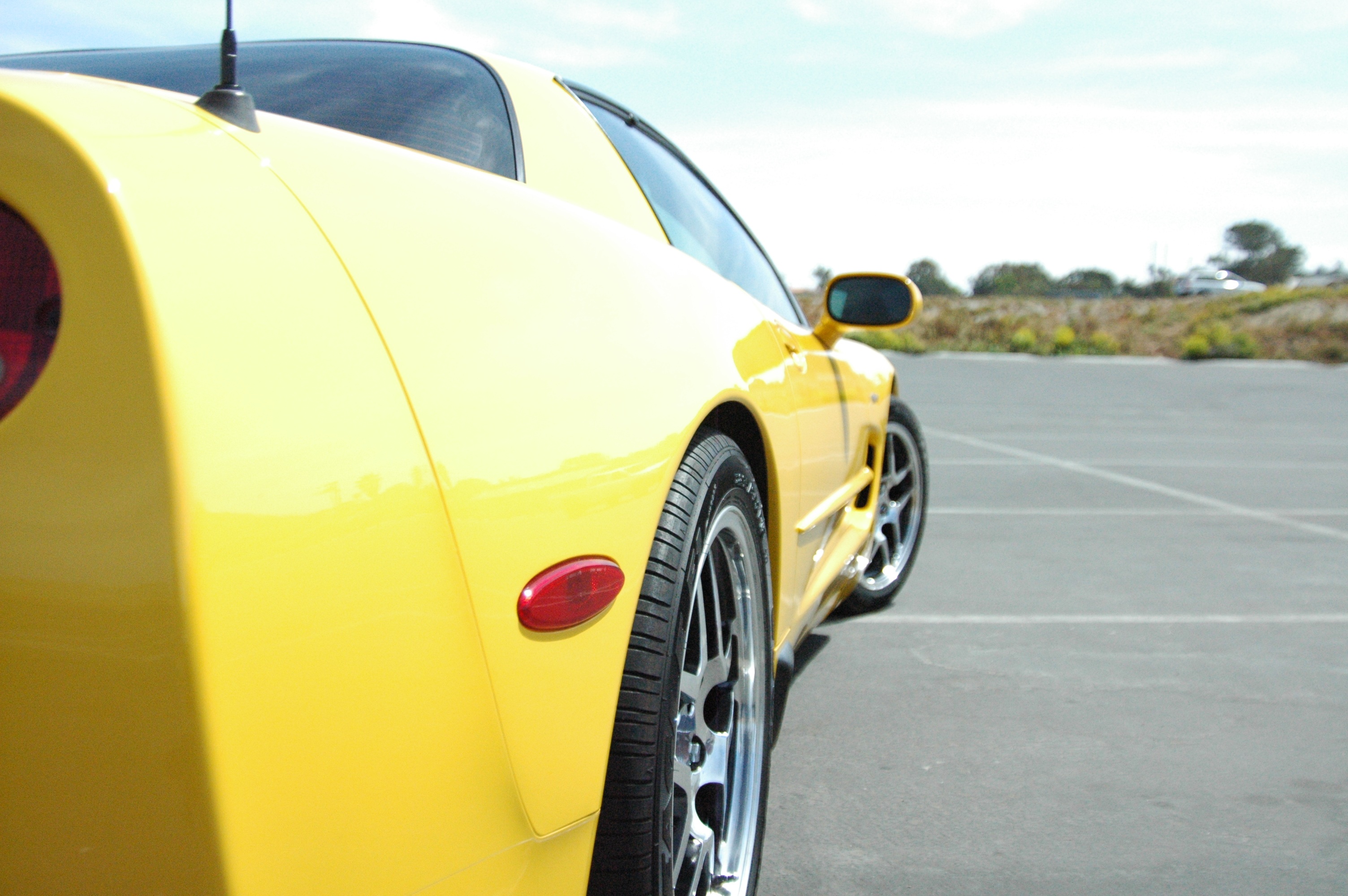 sports Car, sunlight, yellow, yellow car, sign, road, 2K, mode of transportation, outdoors, wheel, travel, c, stationary, day, motor vehicle, retro styled, HD Wallpaper