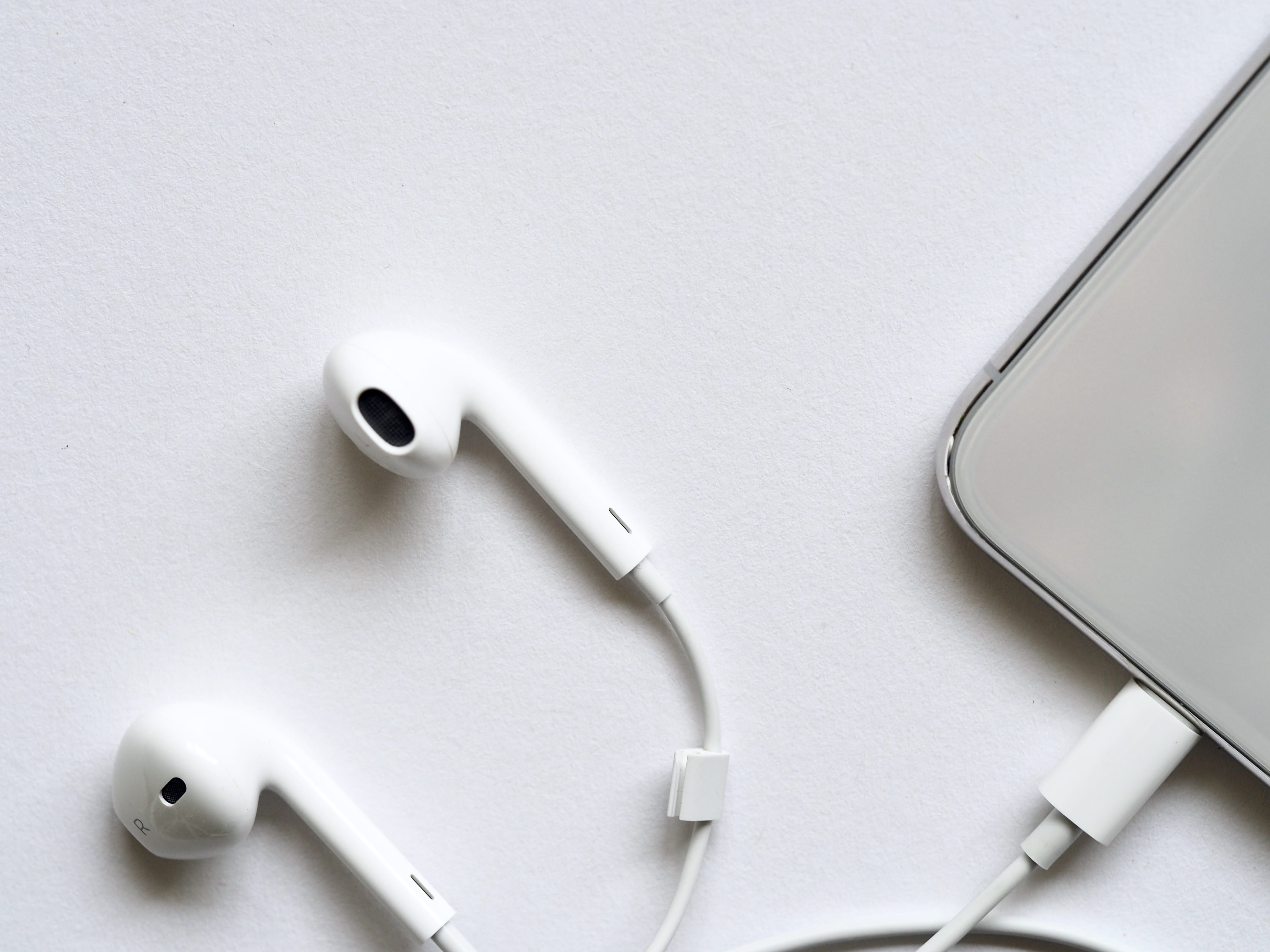 directly above, studio shot, smartphone, desk, 4K, shape, inside, no people, music, earphones, device, apple, silver, in-ear headphones, cellphone, phone, HD Wallpaper