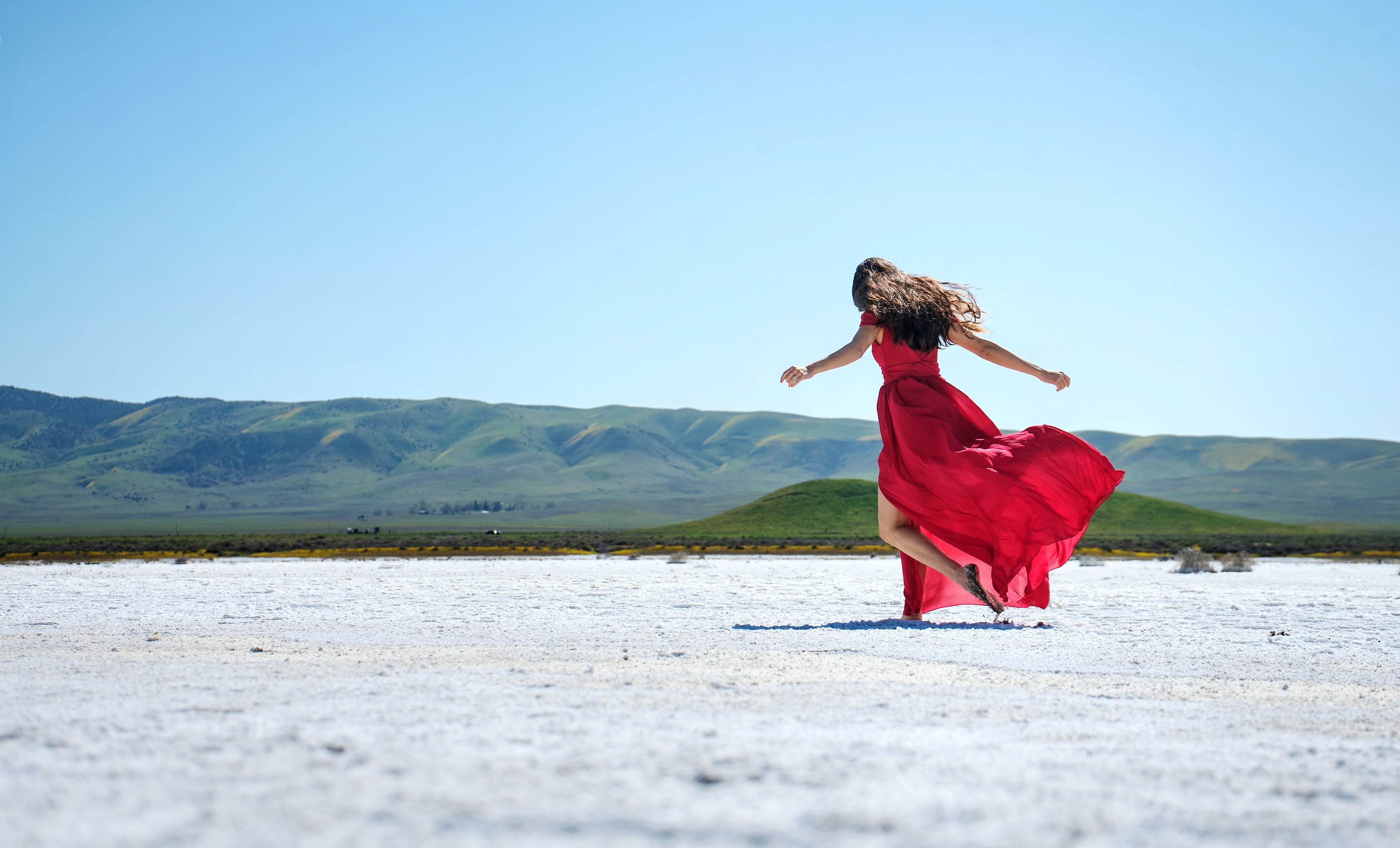 brunette, long hair, nature, space, back, sand, hills, pose, red dress, 4K, girl, the sky, hand in hand, HD Wallpaper