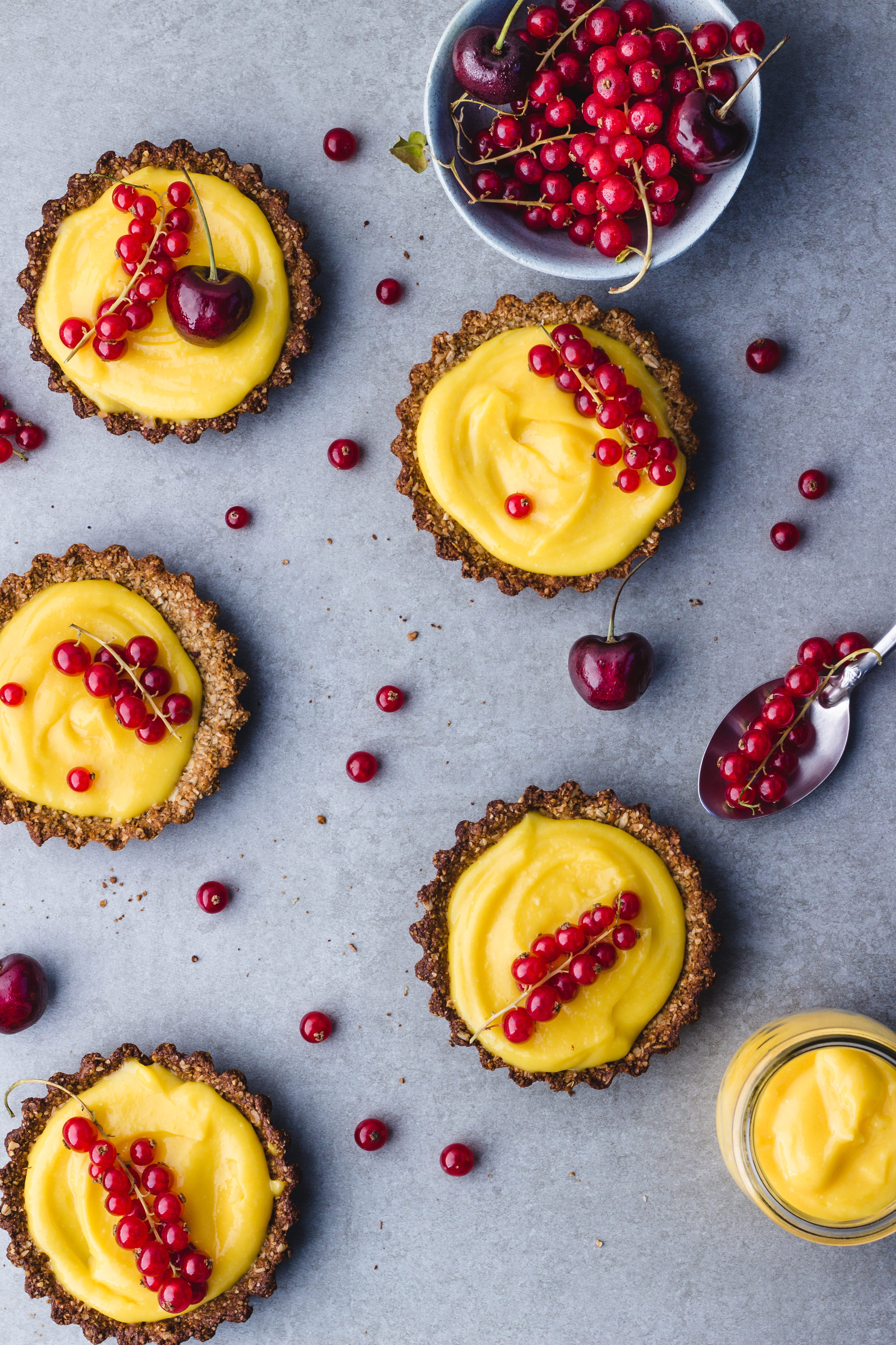 berries, creme, dessert, spoon, indoors, cake, table, lemon, cream, curd, cherry, berry fruit, slice, shop, tart, custard, bakery, currants, sweet food, Phone HD Wallpaper