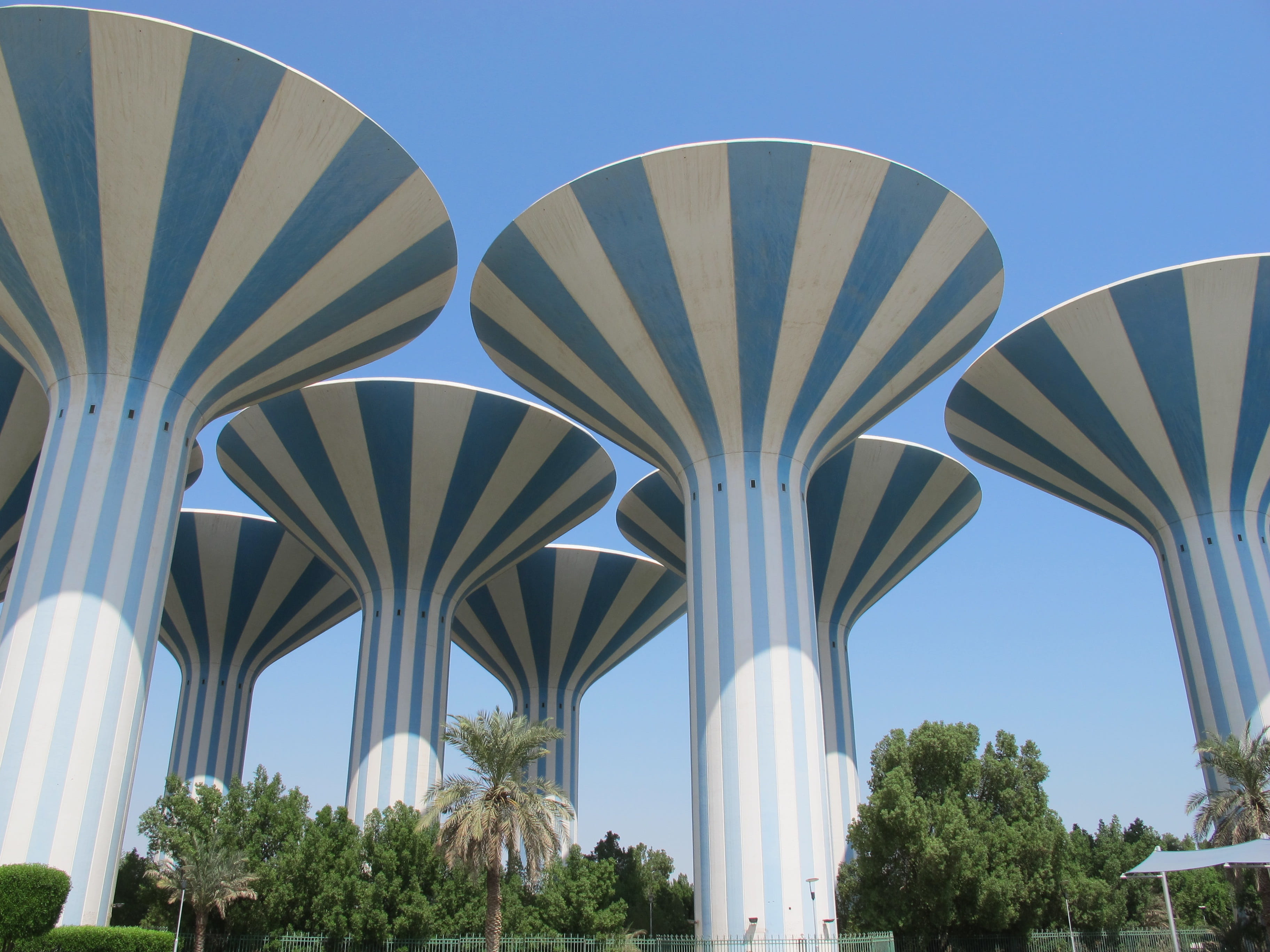 tower, architectural, attraction, kuwait, low angle view, pattern, Arabian, clear sky, arch, luxury, arabian, landmark, built structure, plant, sunny, no people, HD Wallpaper