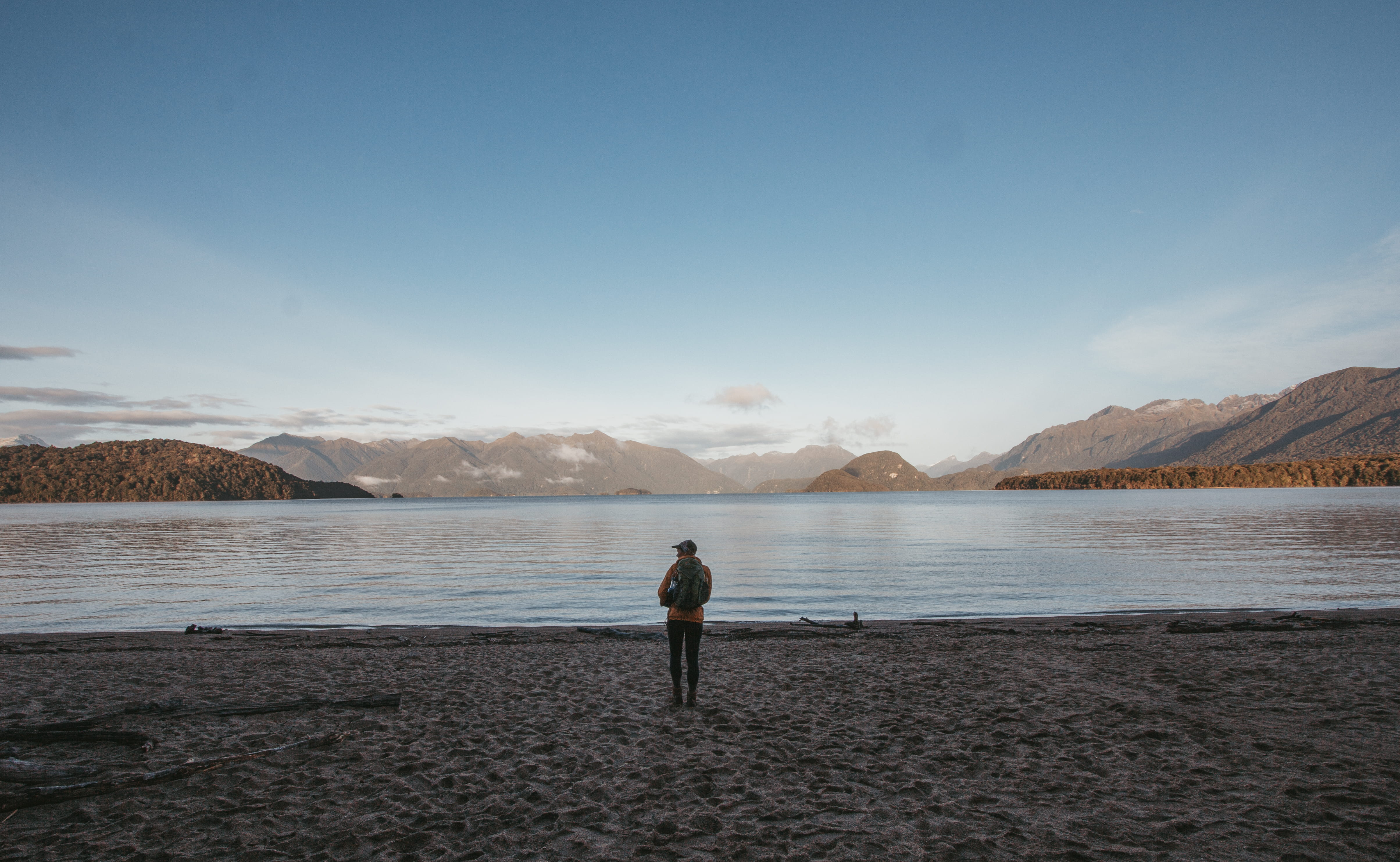 rear view, sky, one person, beauty in nature, slope, lake, standing, shoreline, scenics - nature, looking at view, man, nature, full length, 4K, new zealand, HD Wallpaper