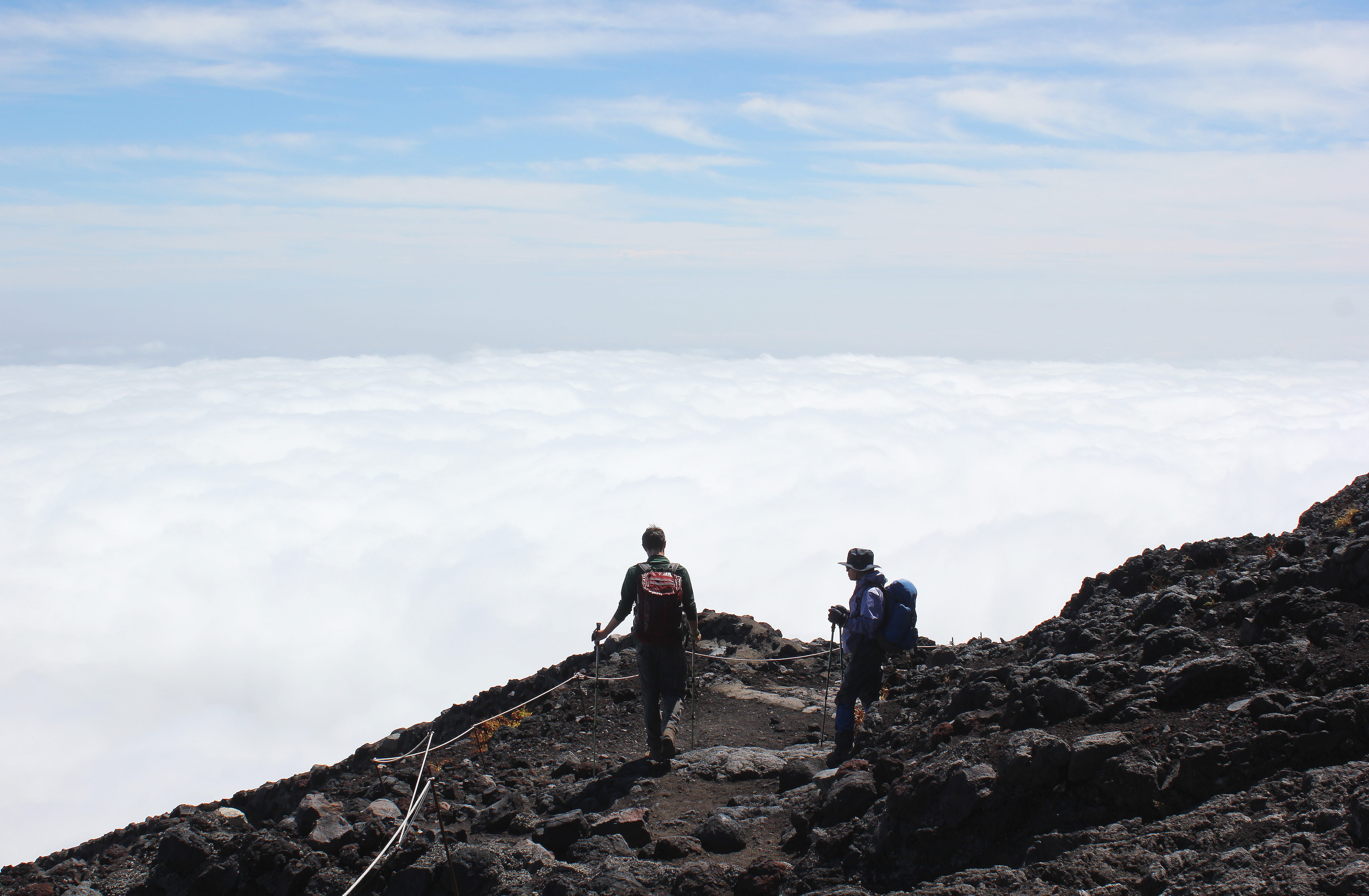 rock - object, altitude, japan, leisure activity, mount fuji, solid, rock, sky, 5K, clouds, standing, men, outdoor, two people, hike, mountain climbing, HD Wallpaper