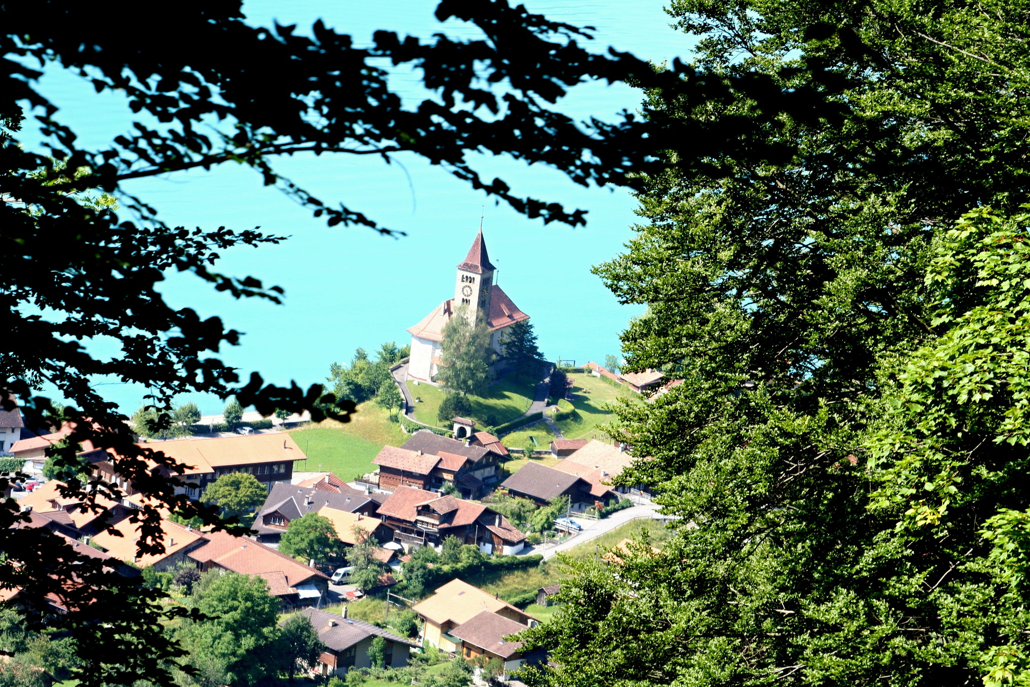outdoors, lake of brienz, booked, building exterior, switzerland, haze, church, green color, home, spire, brienz, day, 2K, spirituality, nature, religion, HD Wallpaper