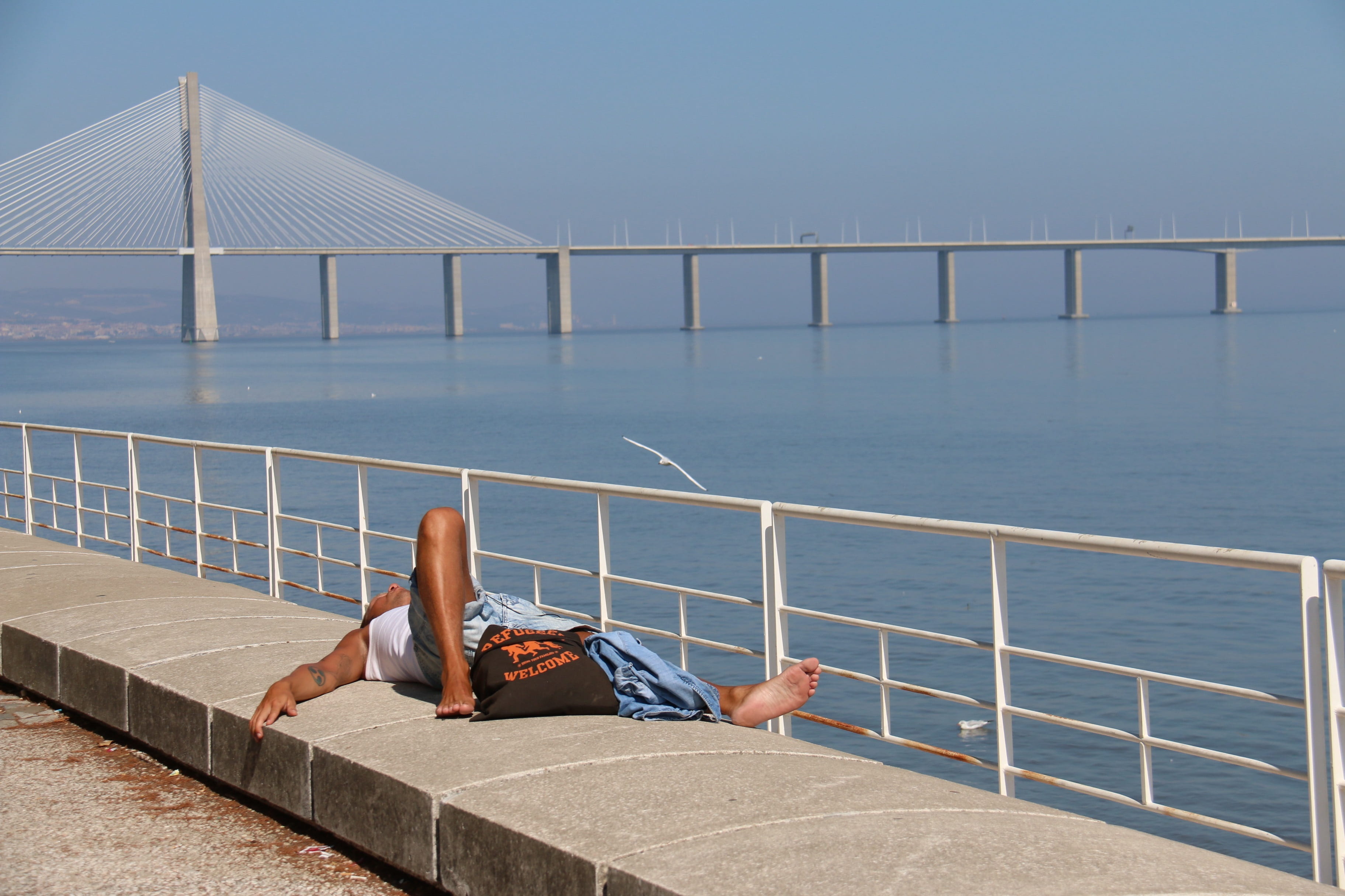 tranquility, relax, lying down, rio, outdoors, sleep, lying, blue, landscape, adult, natural beauty, sea, heat, horizon, holidays, water, railing, one person, HD Wallpaper