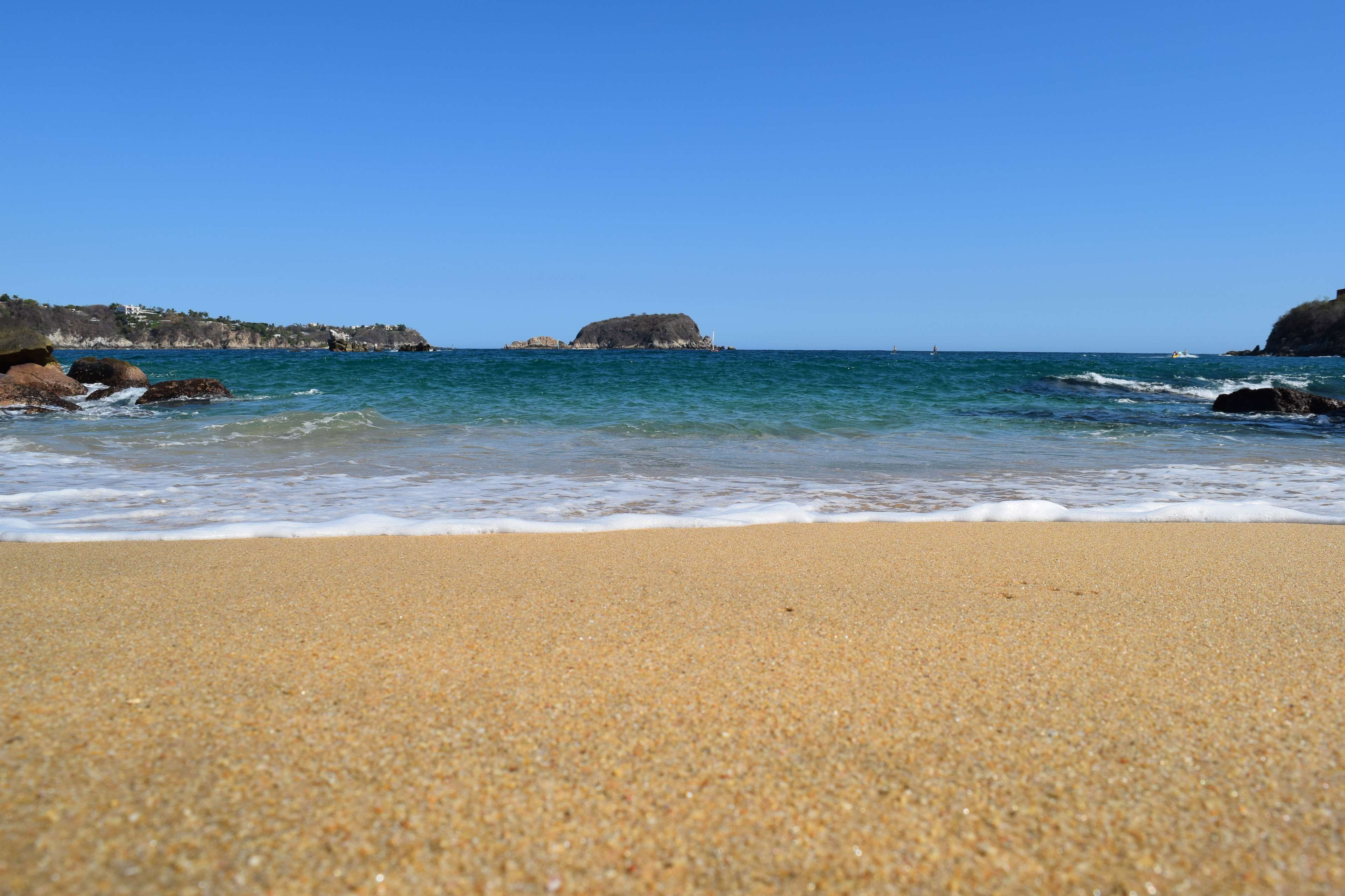 beauty in nature, beach, water, motion, travel, nature, sunny, outdoors, no people, playa, rock, oaxaca, aquatic sport, tranquility, clear sky, horizon over water, HD Wallpaper