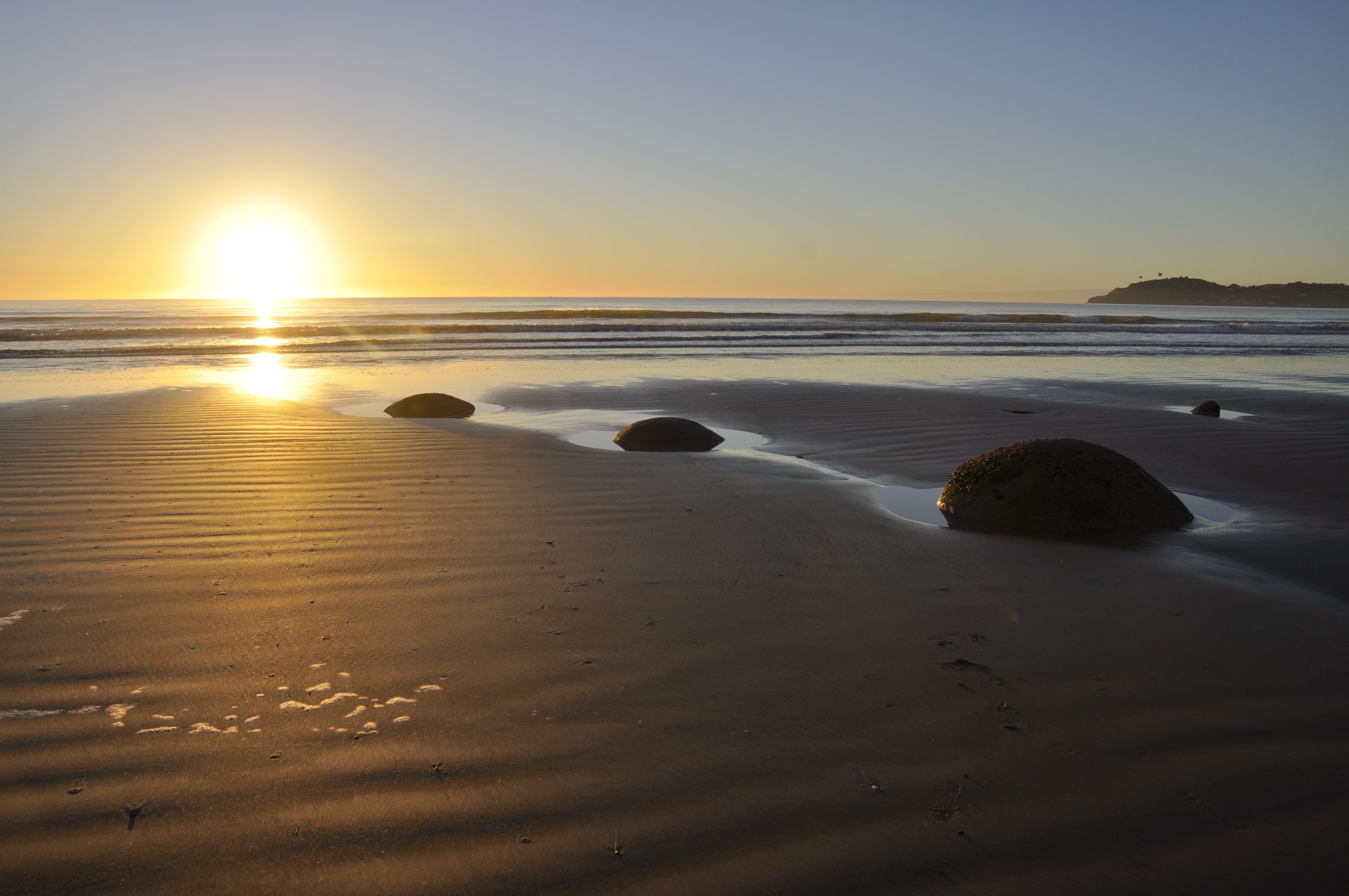sunset, surface level, new, zealand, stone, famous, land, ocean, non-urban scene, nature, low tide, tranquility, round, 4K, coastline, sun, rock, landscape, HD Wallpaper