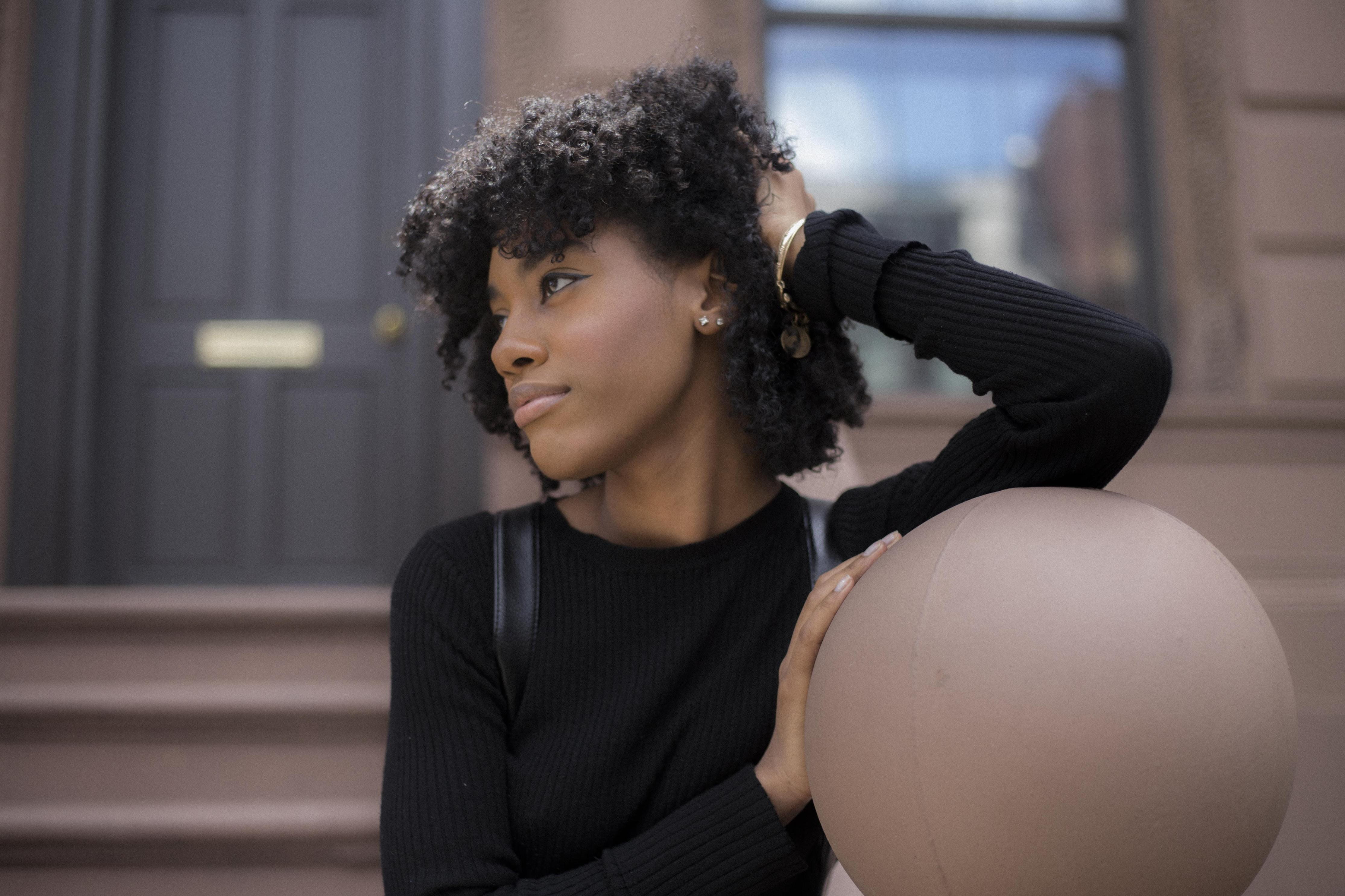 Portraits, headshot, brownstone, outside, Emotion, Diversity, standing, curly hair, 4K, black hair, body part, indoors, looking, focus on foreground, woman, HD Wallpaper
