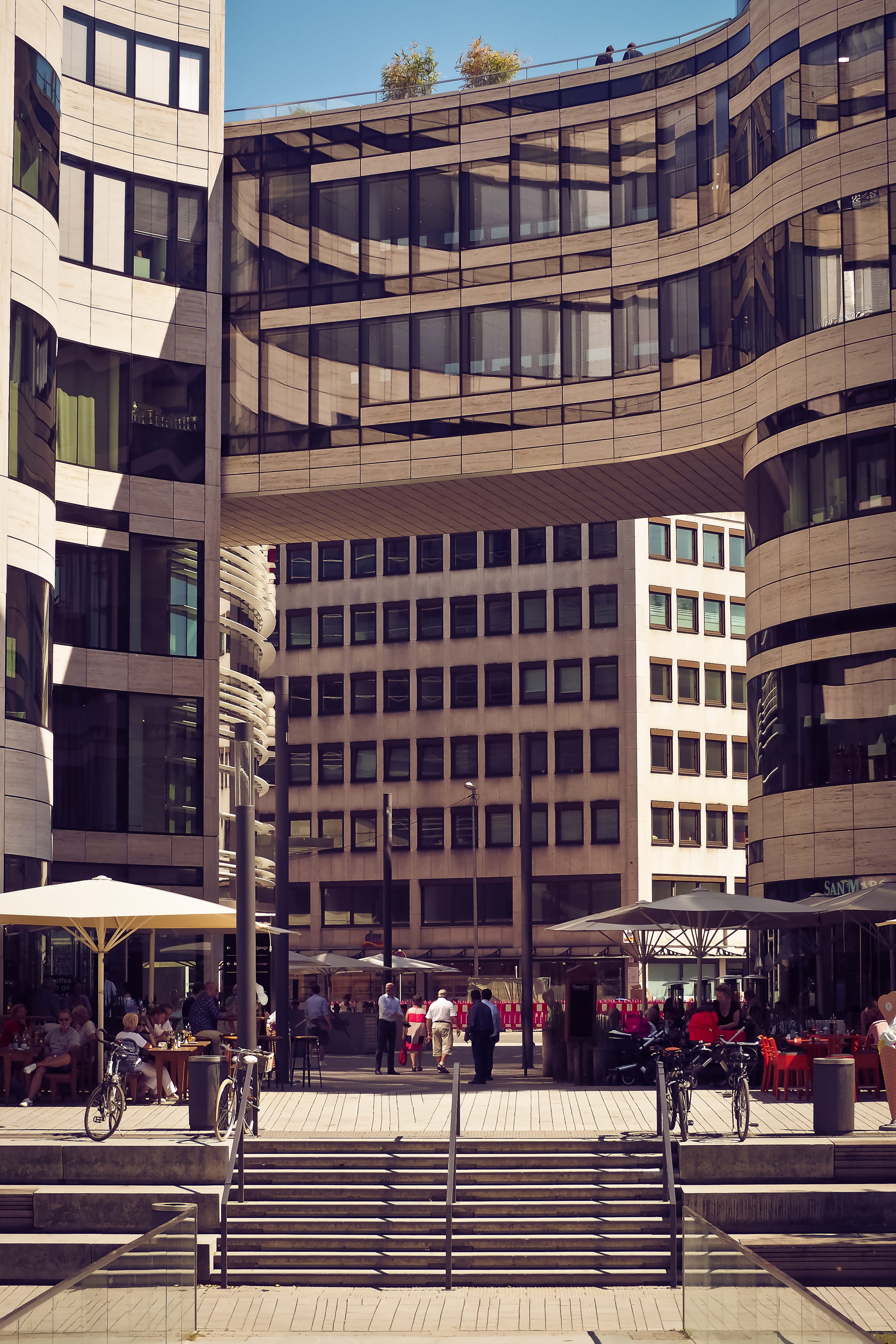 abstract, Modern, düsseldorf, skyscraper, facade, built Structure, railing, group of people, incidental people, office building exterior, glass facade, Phone HD Wallpaper