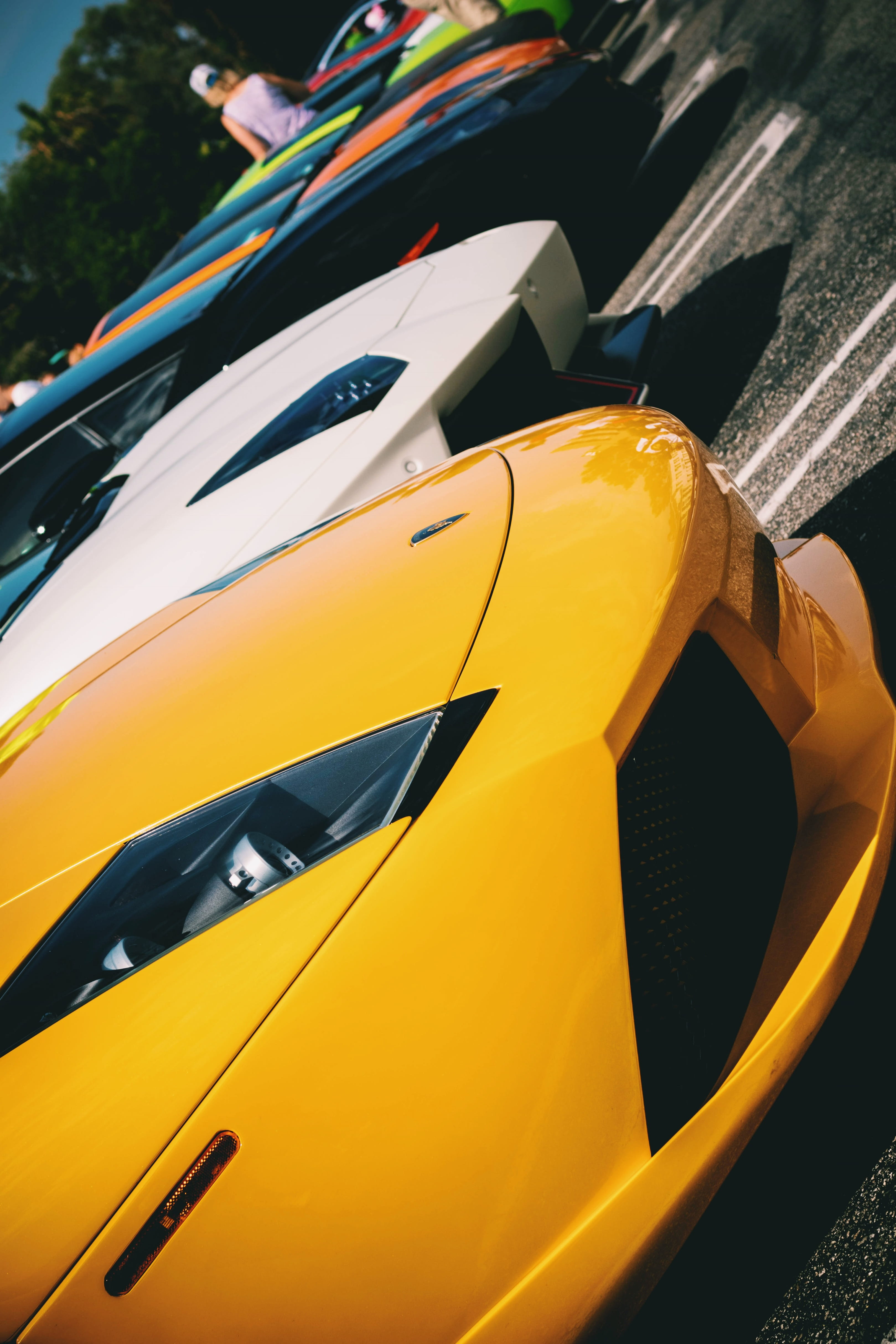 day, car, lamborghini, mode of transportation, yellow, close-up, in a row, yellow taxi, 4K, outdoors, motor vehicle, one person, transportation, hypebeast, Phone HD Wallpaper
