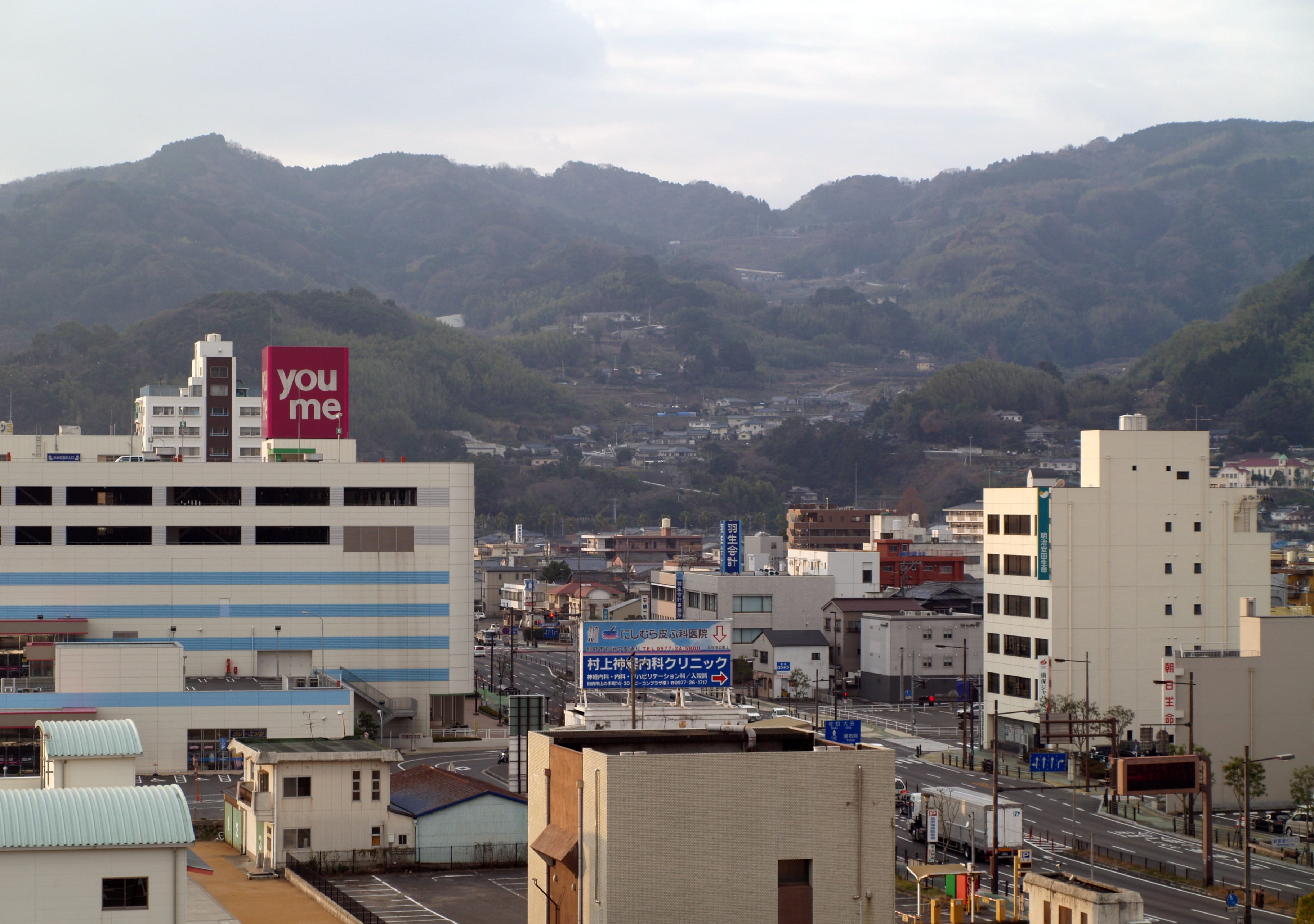 sky, downtown, building, text, City, building exterior, destination, asia, mountain range, nature, mountains, no people, scenery, day, urban, townscape, HD Wallpaper