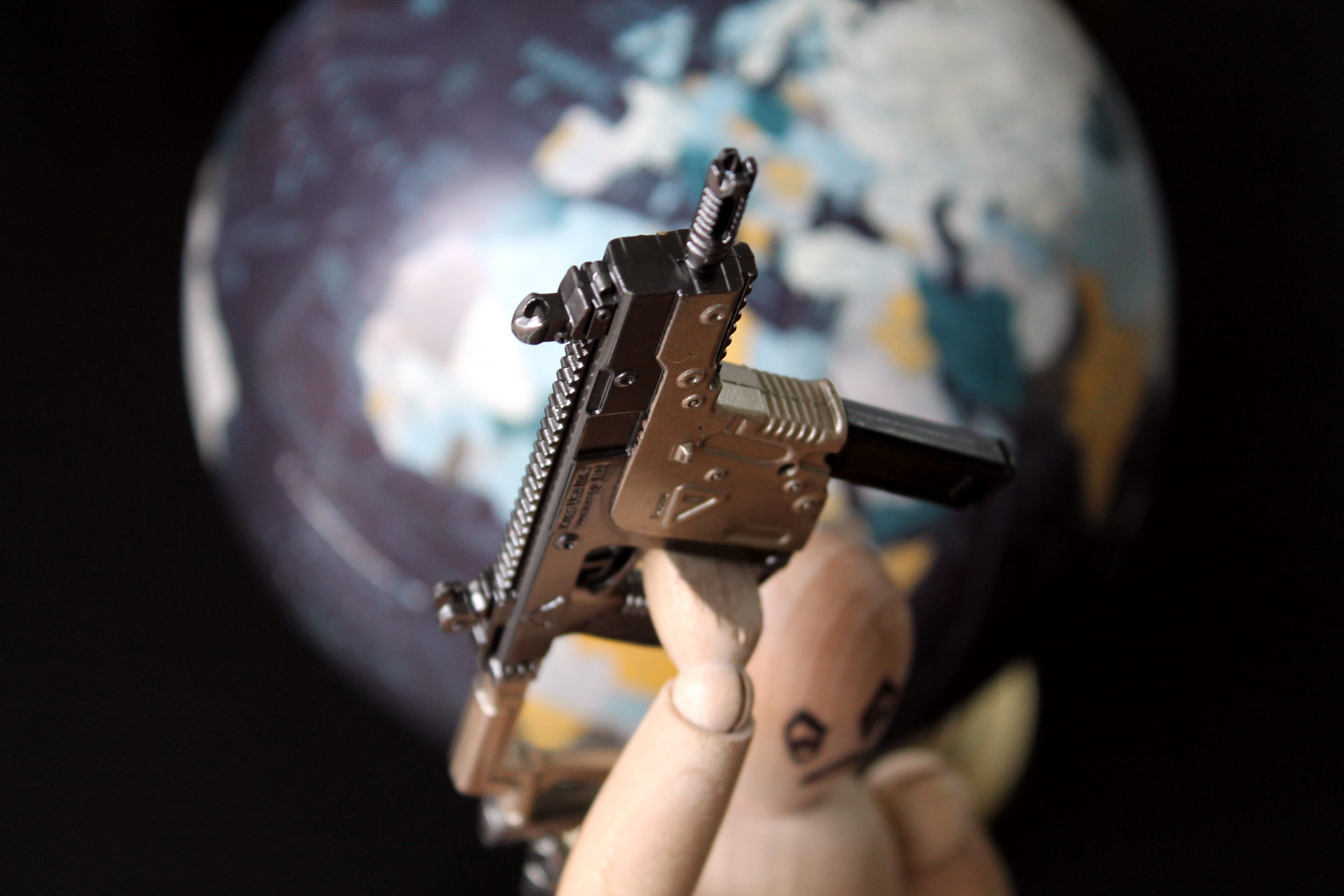 adult, weapon, globe, black background, human hand, music, international terrorism, close-up, holding, body part, performance, government, 4K, studio shot, HD Wallpaper