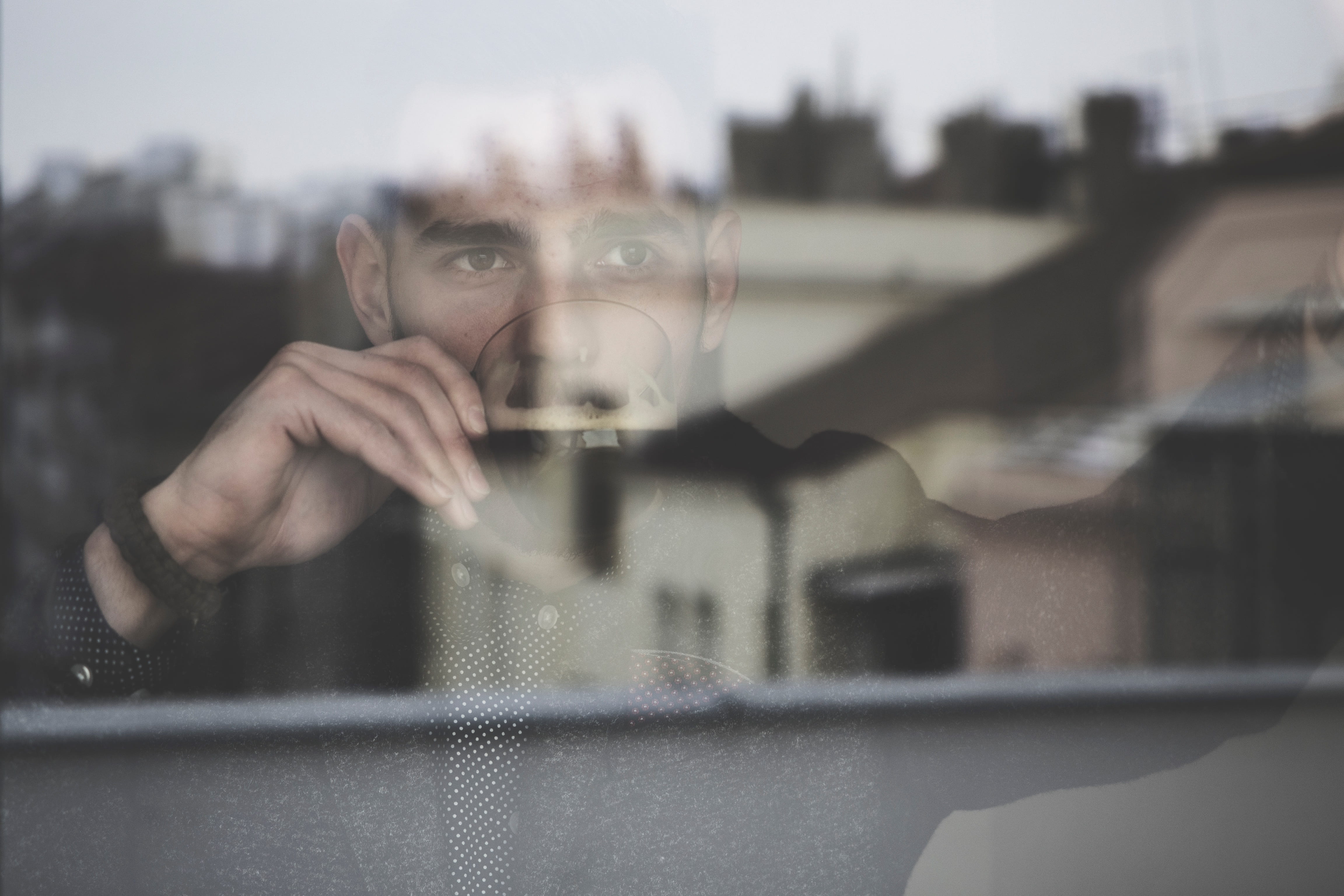 headshot, 4K, drinking, coffee, reflection, top, people, black, window, day, man, front view, portrait, glass, blur, strap, drink, hand, holding, outdoors, HD Wallpaper