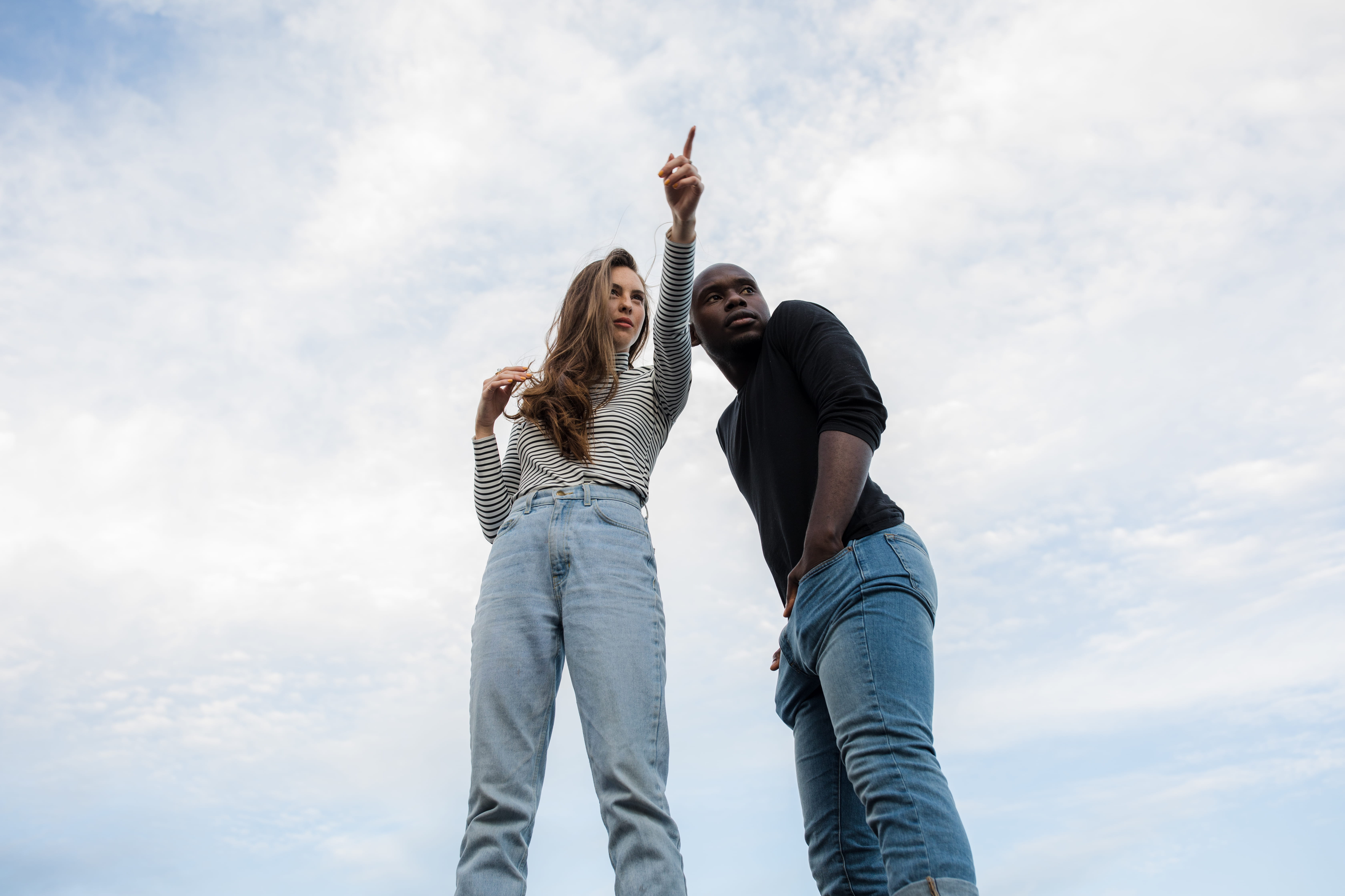 togetherness, photography, women, happiness, two people, arms raised, love, real people, pointing, near, finger, cloud - sky, african american, man, jeans, HD Wallpaper