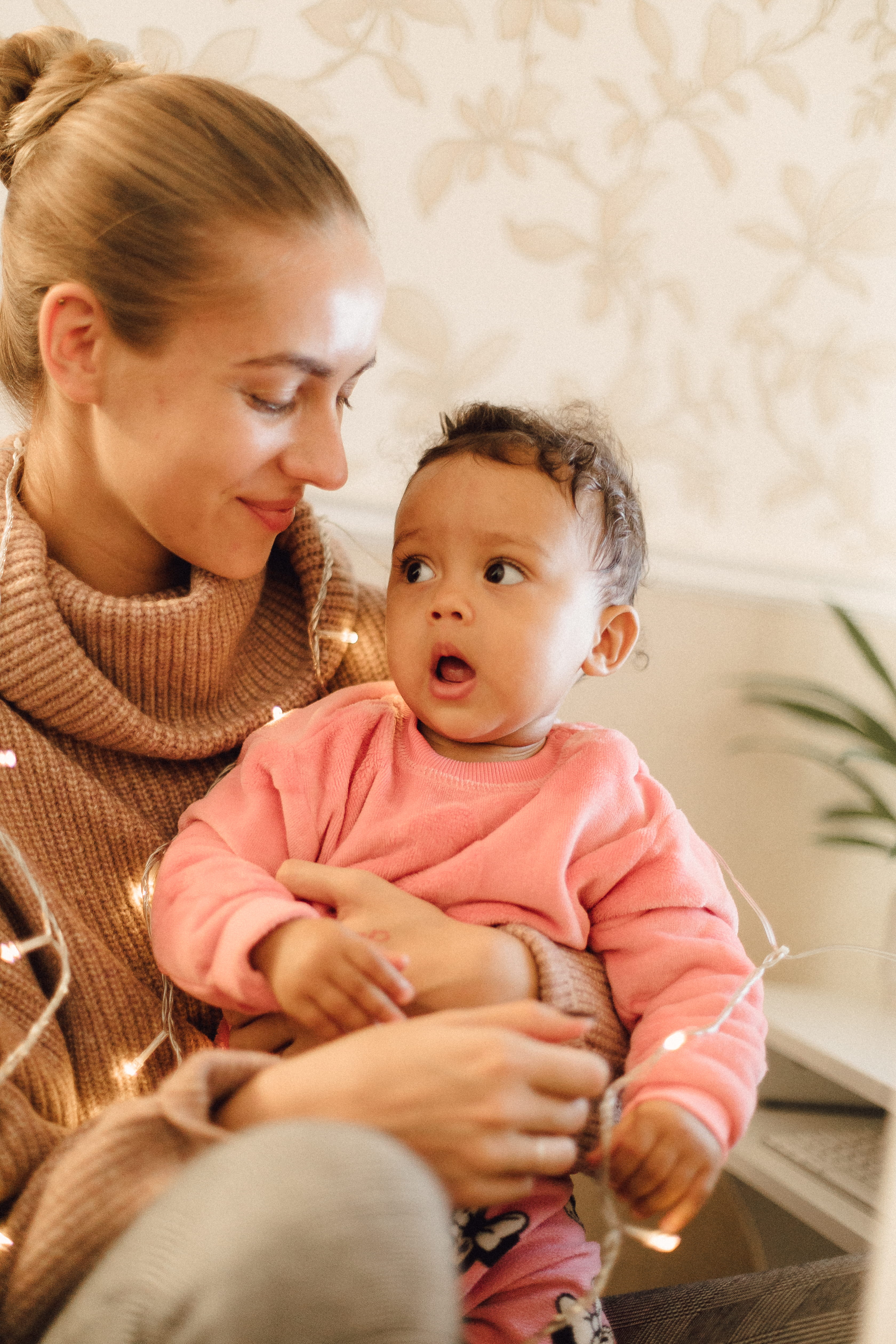 women, clothing, parent, finger, person, bonding, family with one child, wood, furniture, apparel, sitting, innocence, rhyl, electronics, sweater, real people, Phone HD Wallpaper
