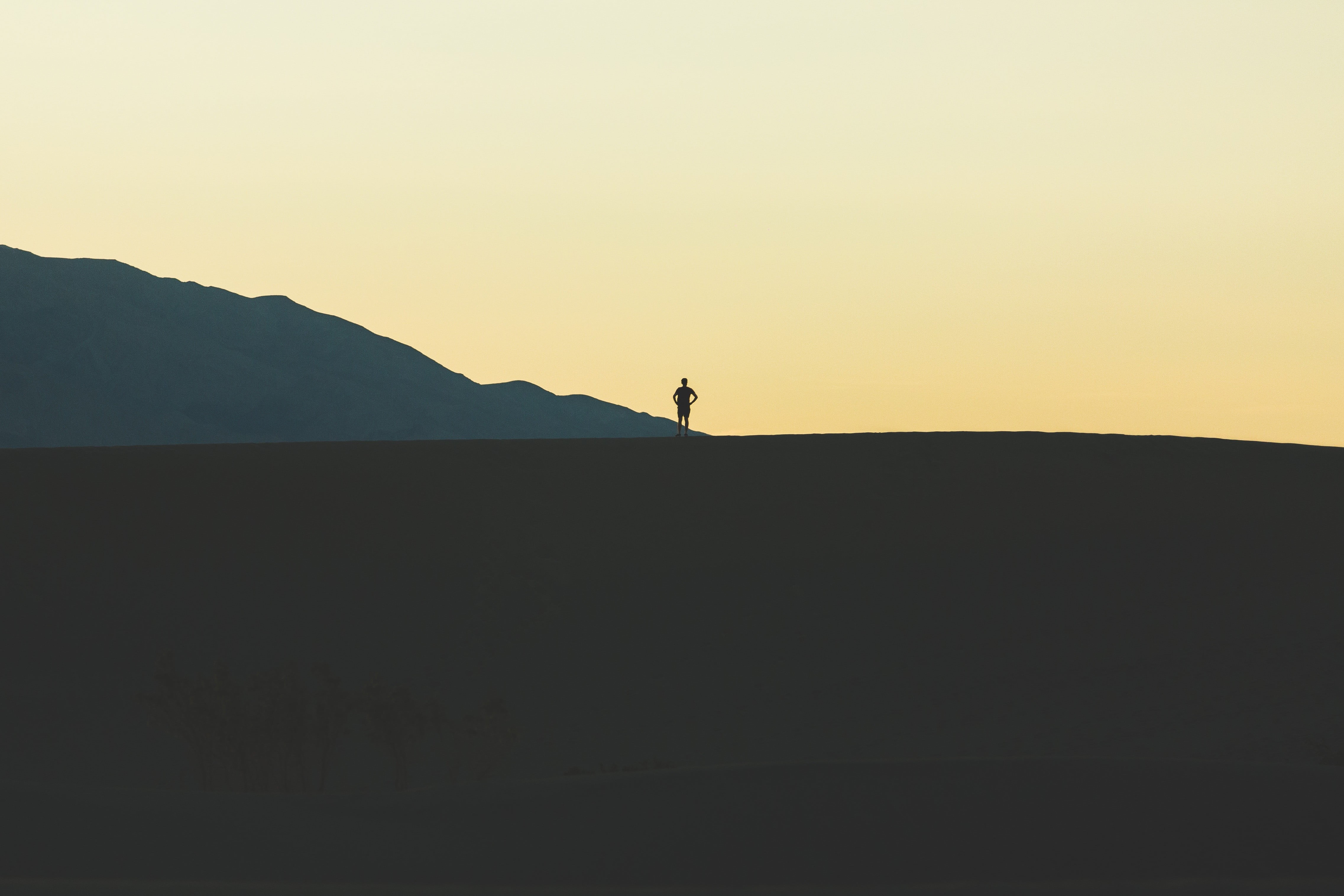 sunset, one person, outdoors, nature, mountains, mountain, sky, black, beauty in nature, lifestyles, real people, landscape, bed, standing, land, tranquility, HD Wallpaper