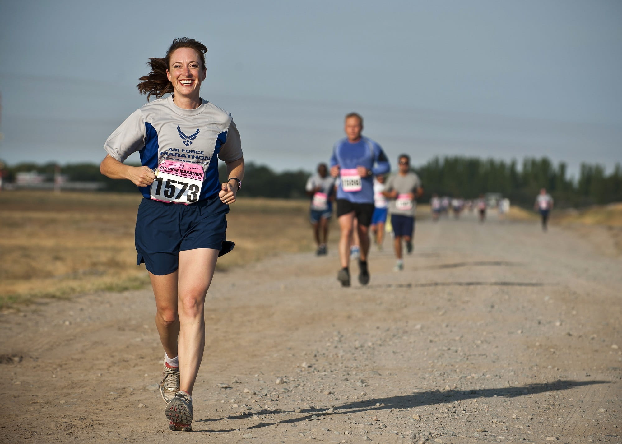 smiling, men, young women, running, full length, shirt, cardio, dirt road, happiness, athletes, 1080P, brown, front view, real people, woman, sunlight, HD Wallpaper