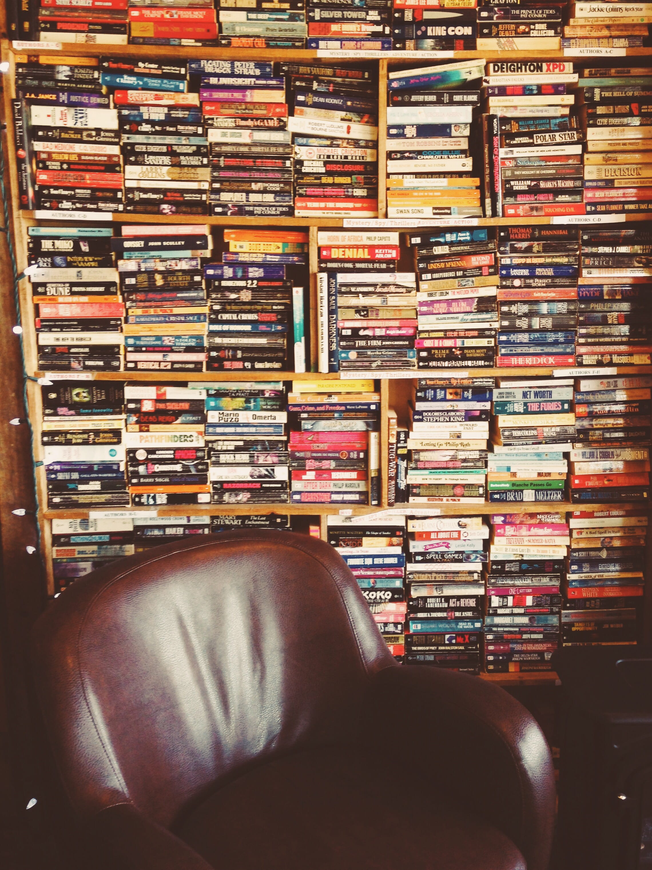 people, arrangement, chair, choice, shelf, bookshelf, large group of objects, order, case, stack, video, indoors, in a row, pile, abundance, book, vhs, Phone HD Wallpaper