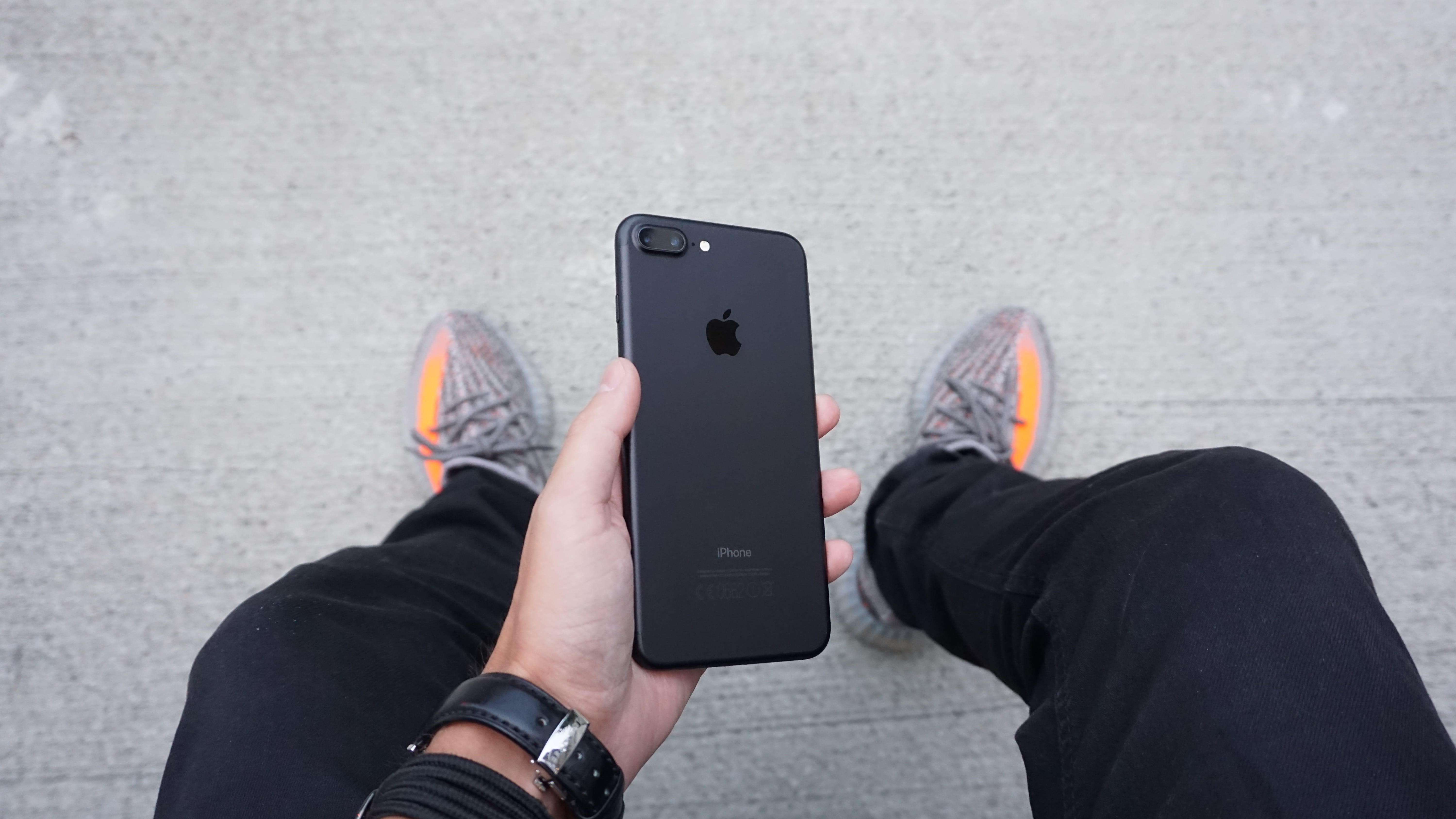 using phone, 5K, portable information device, yeezy boosts, matte black, smart phone, iphone, person, one person, ultraboosts, human body part, telephone, HD Wallpaper