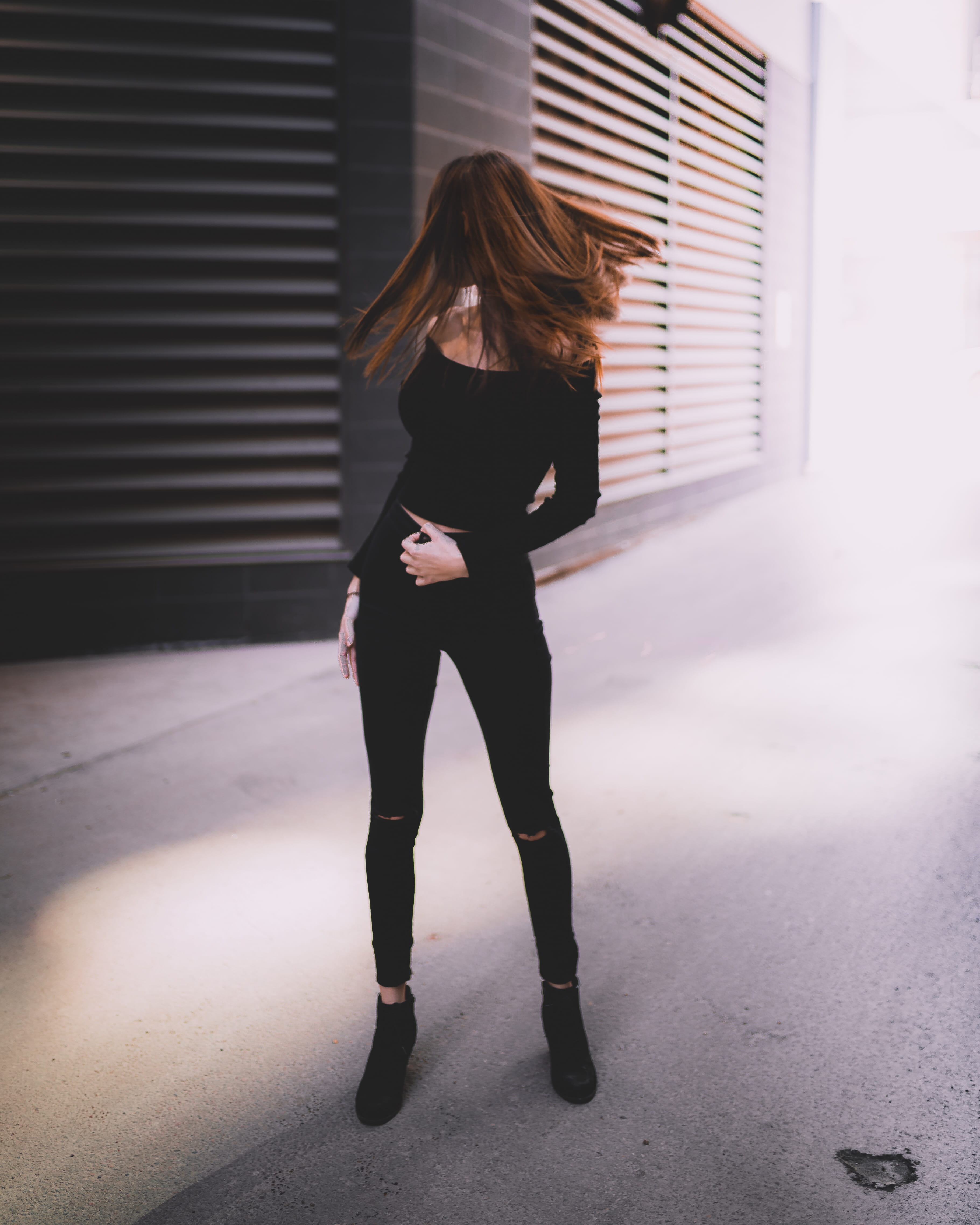 day, adult, architecture, move, flipping, adventure, pants, model, female, fashion, shadow, young women, hairstyle, light, real people, building exterior, Phone HD Wallpaper