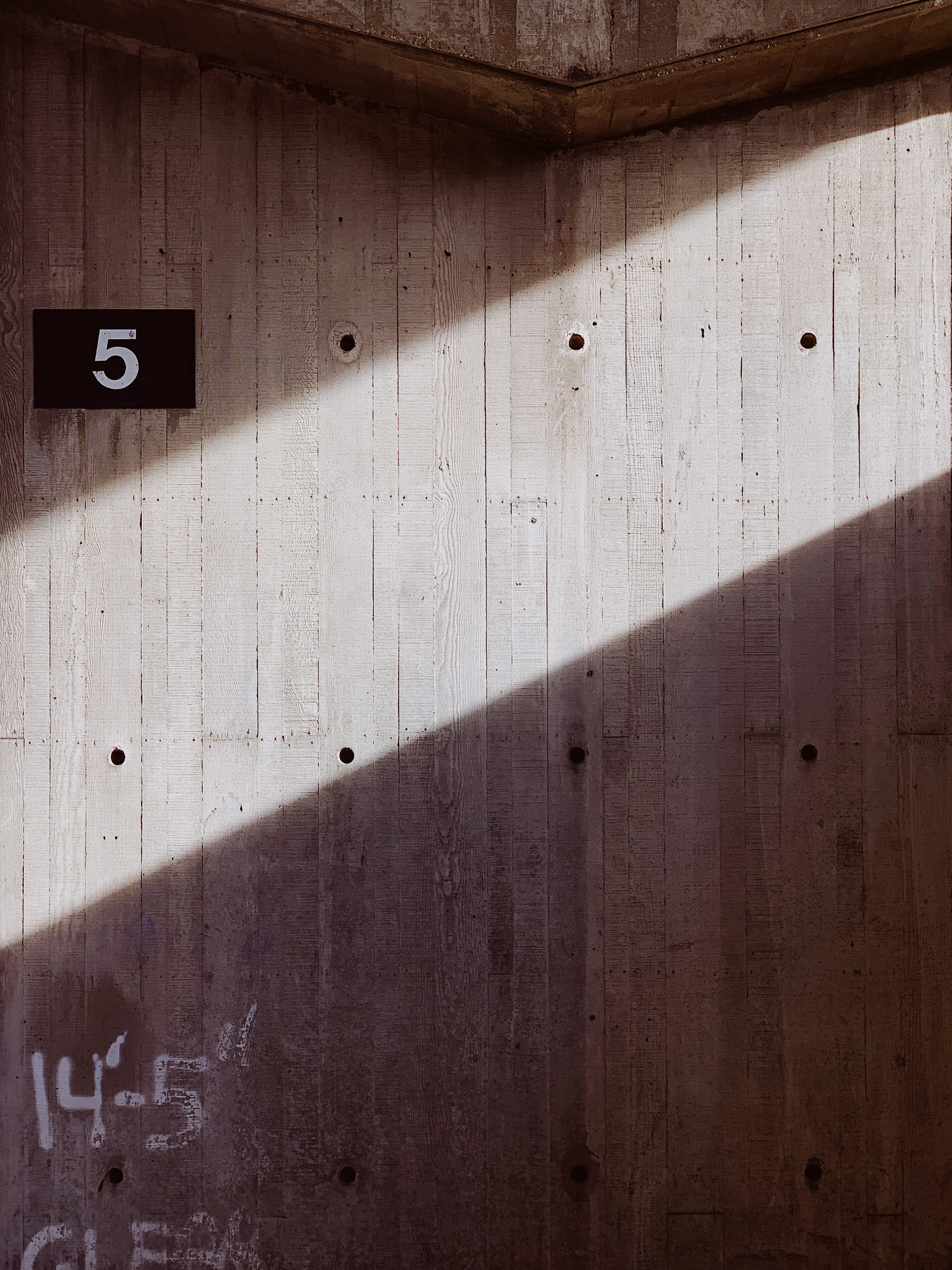 clothing, coat, indoors, concrete, apparel, floor, light, close-up, wood - material, architecture, overcoat, wood, tire, sunlight, communication, sign, Phone HD Wallpaper