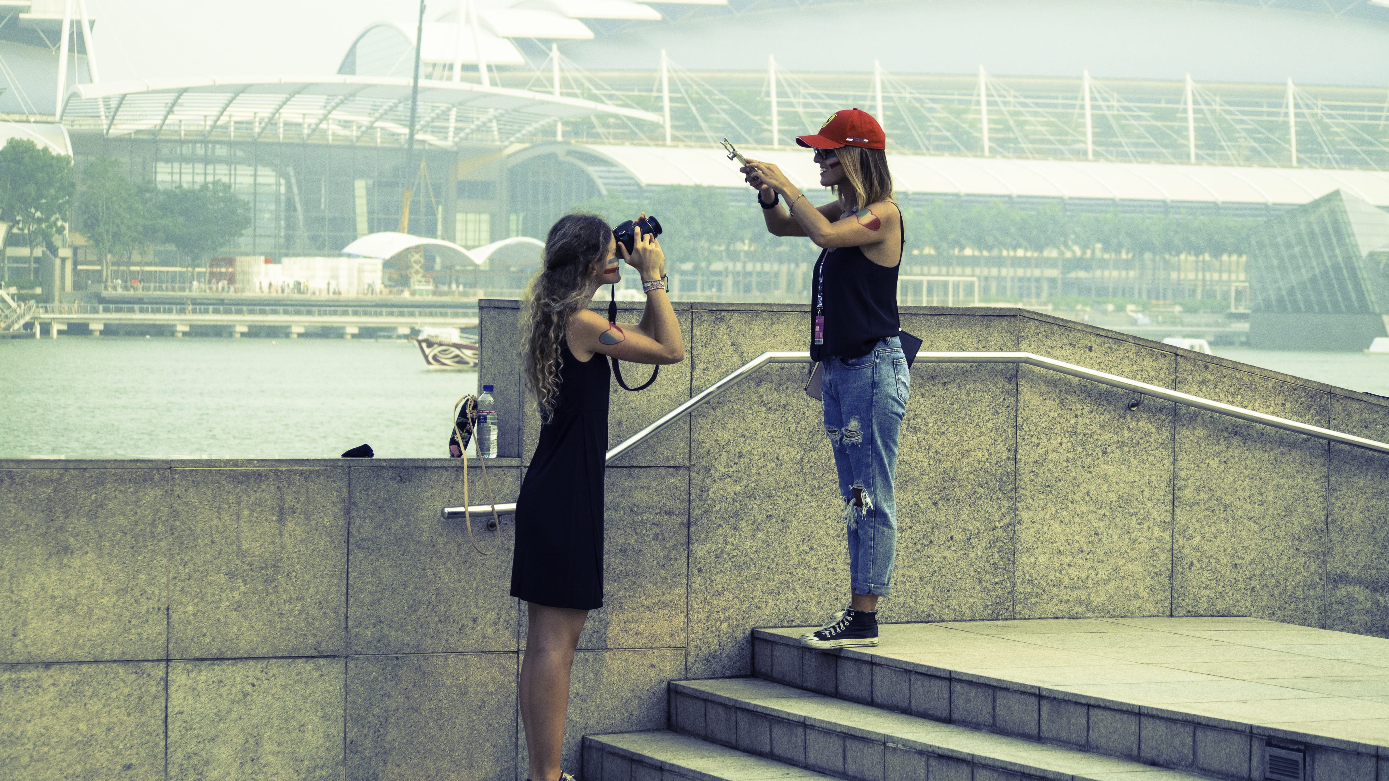 architecture, happy, s, joy, young women, taking, female, outdoors, togetherness, concrete, gray, celebration, together, fun, joyful, photographer, camera - photographic equipment, HD Wallpaper