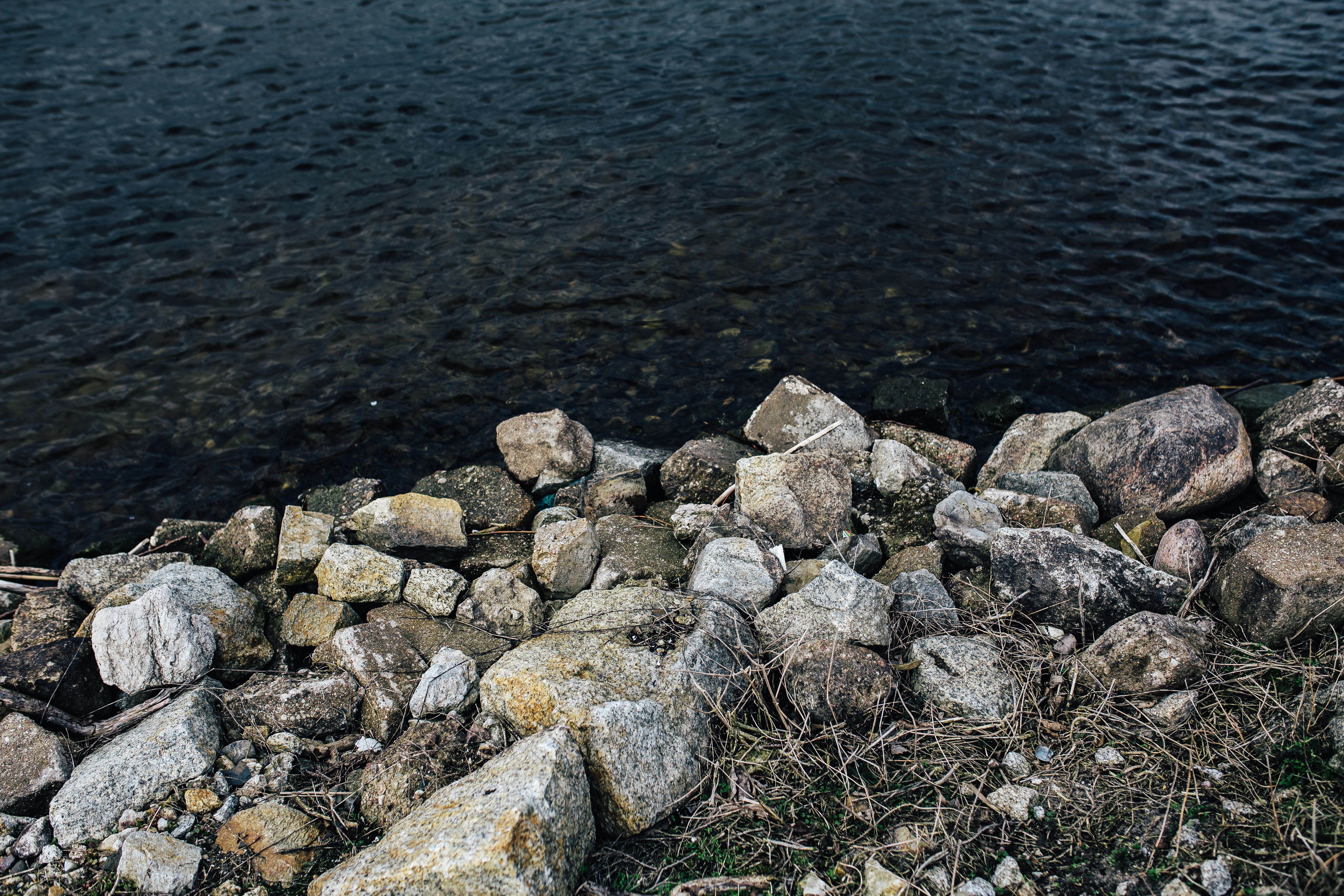 outdoors, stone - Object, high angle view, by the sea, rock - Object, 5K, pebble, beauty in nature, boat, textured, beach, no People, lake, nature, solid, HD Wallpaper