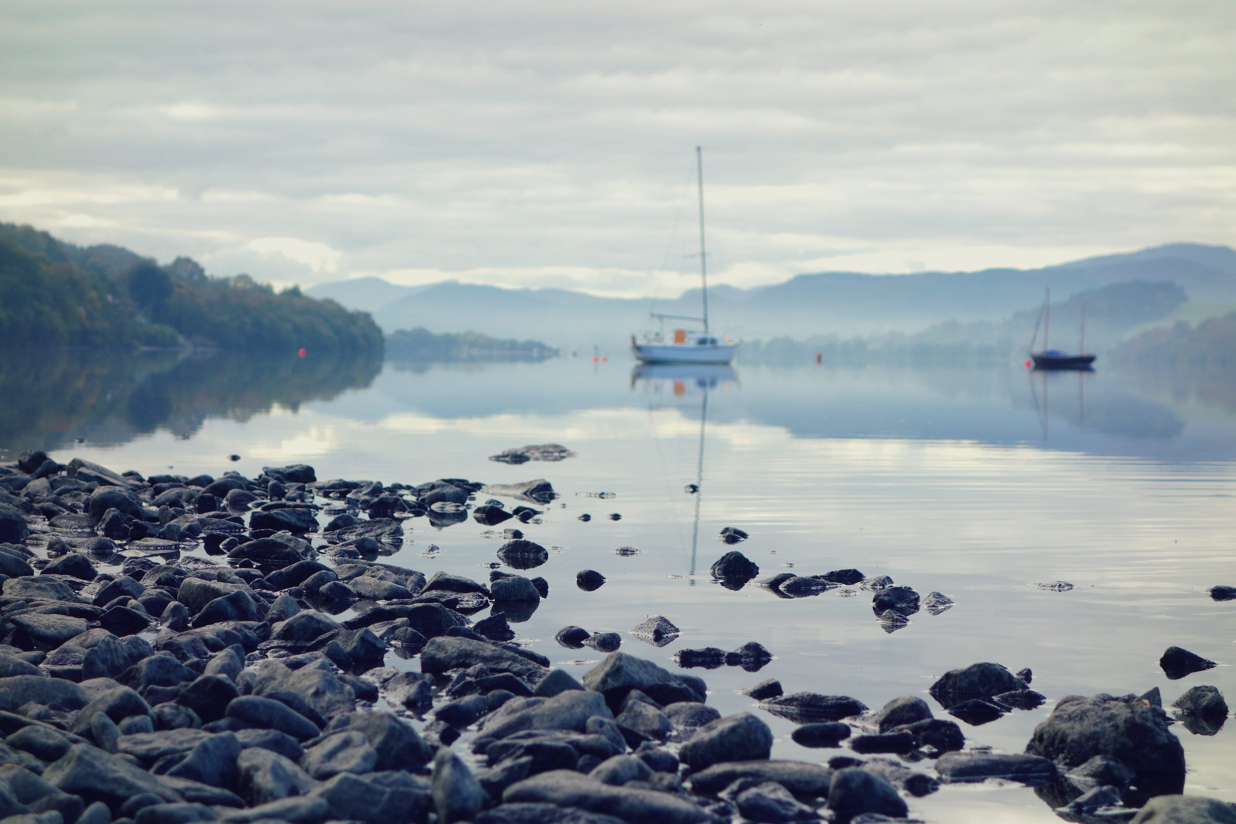 bala, no people, cloud - sky, idyllic, rock - object, boat, tranquility, non-urban scene, pebble, reflection, outdoors, solid, sea, rock, sailboat, llyn tegid, HD Wallpaper