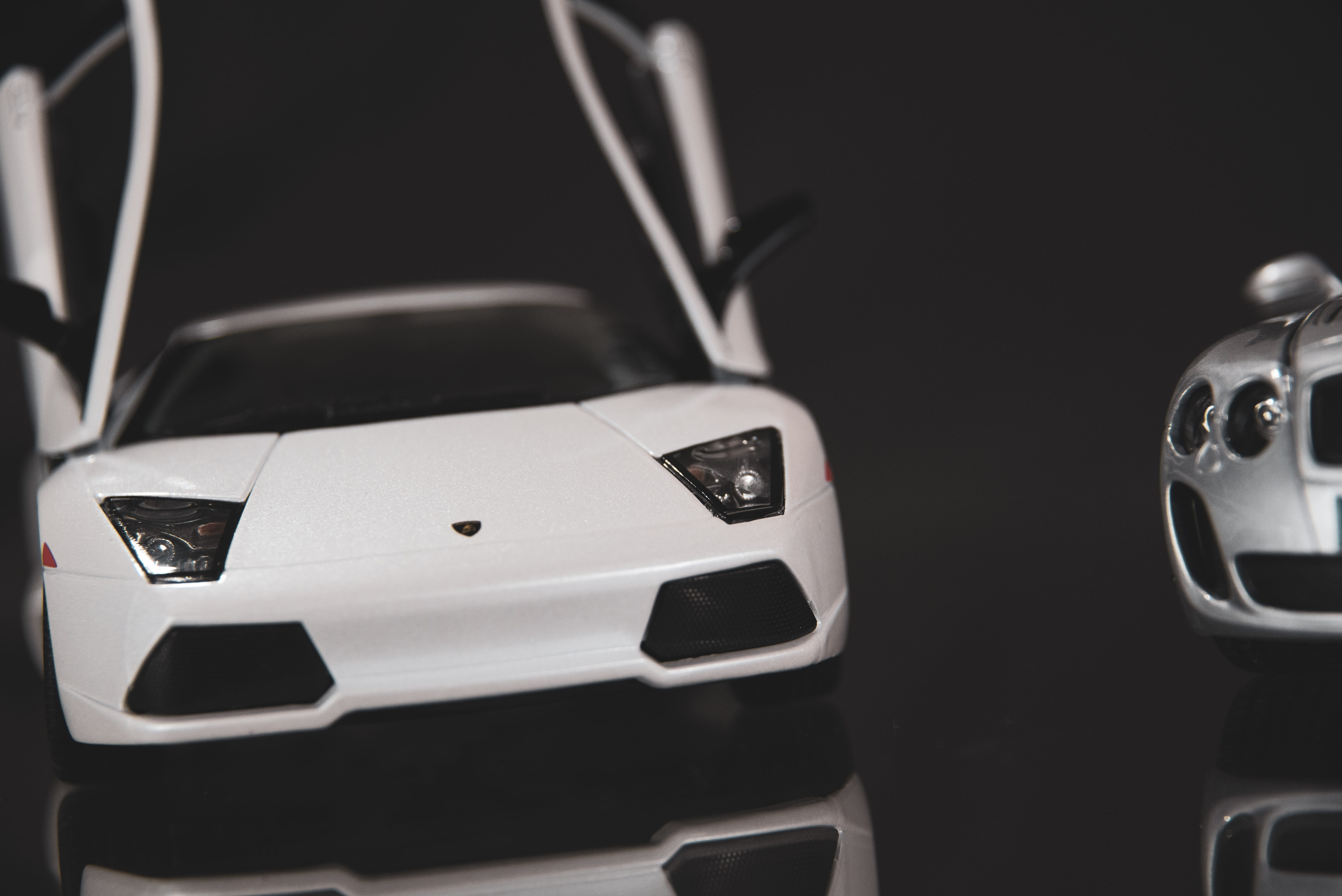 focus on foreground, bumper, toy, alloy wheel, cell phone, mobile phone, still life, car, wheel, transportation, studio shot, close-up, car wheel, vehicle, HD Wallpaper