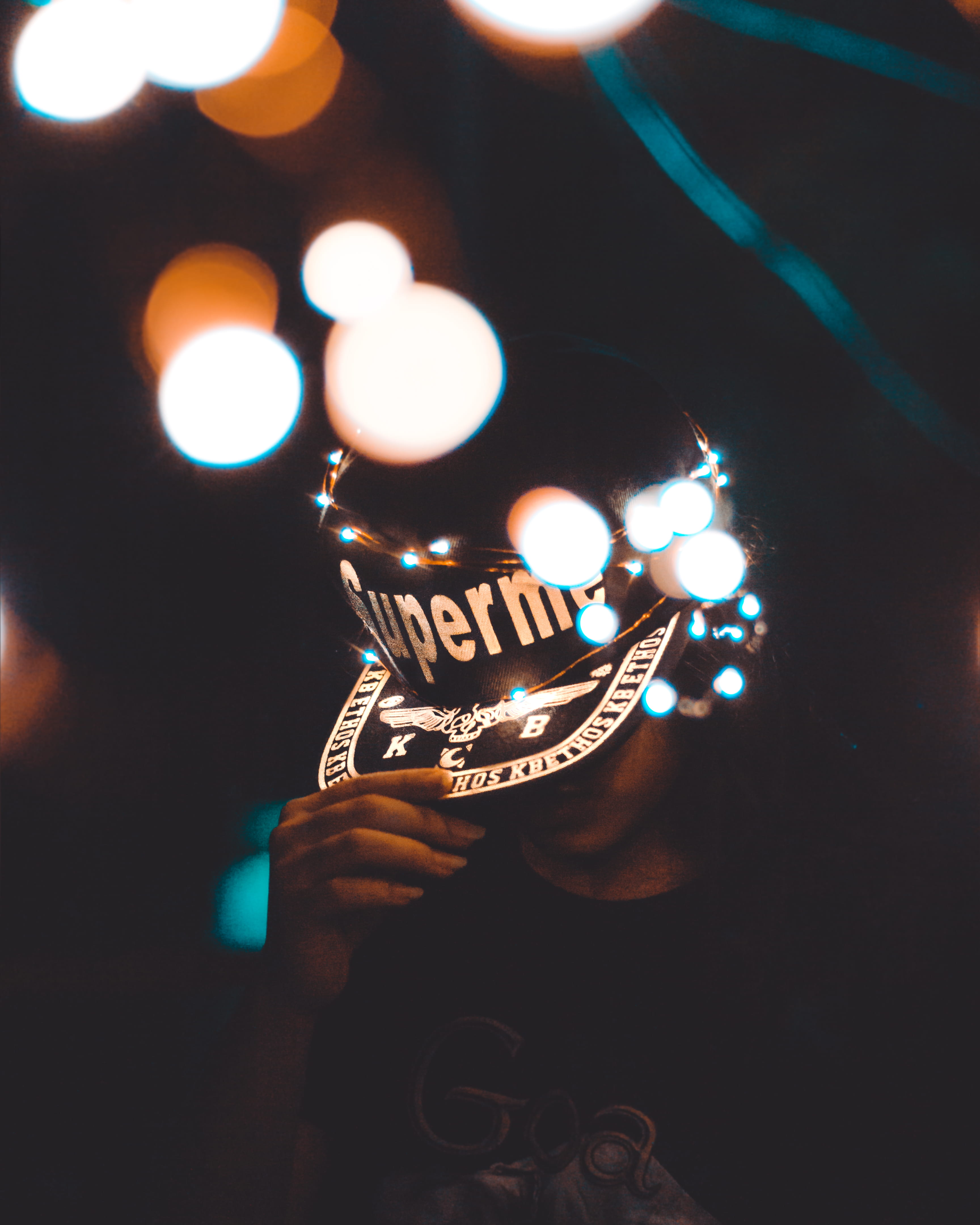 young adult, human body part, lifestyles, unrecognizable person, low light, lens flare, one person, indore, illuminated, real people, mishra nagar, cap, Phone HD Wallpaper