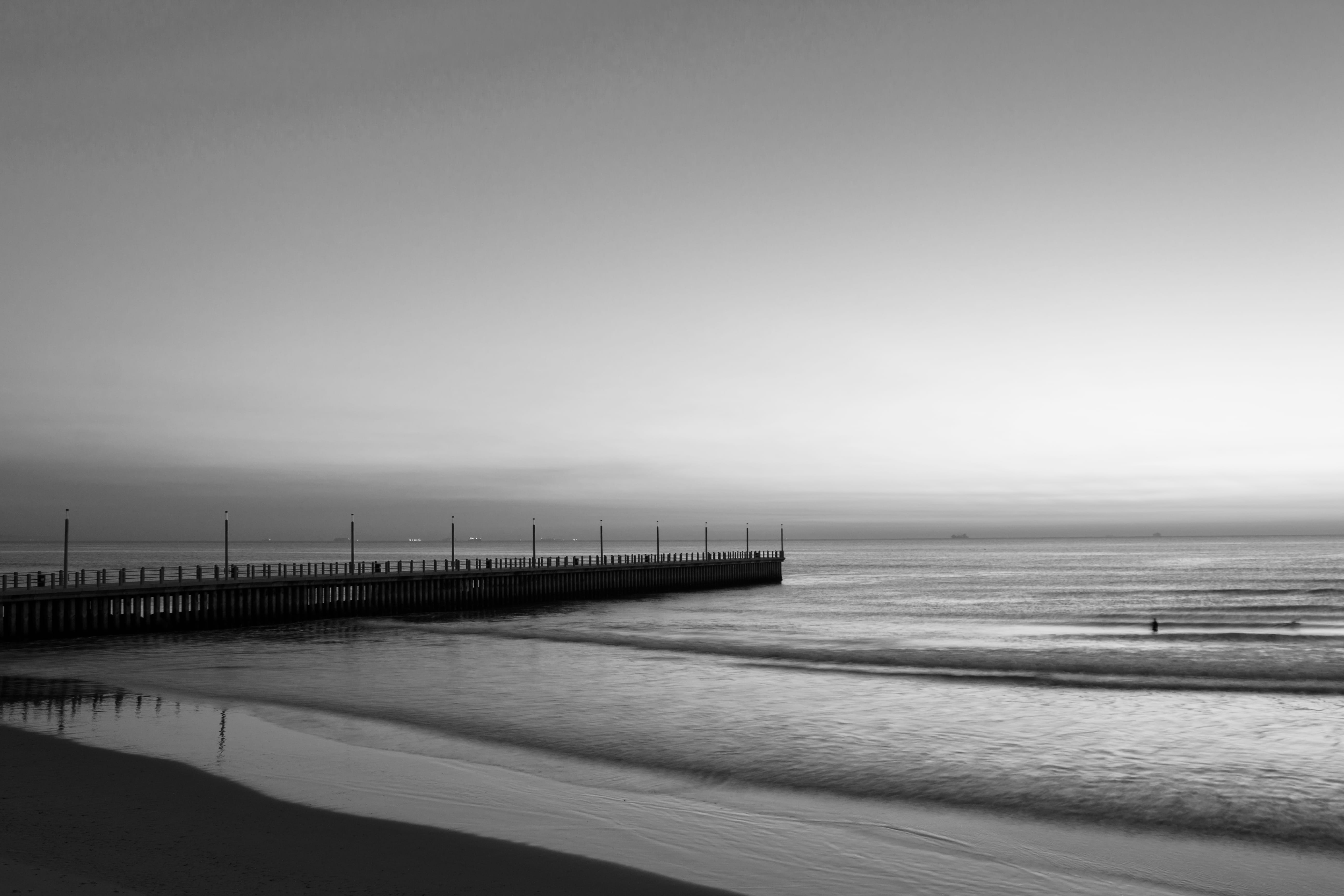 north pier, durban, water, non-urban scene, sea, darrel collins, south africa, sand, horizon, black and white photography, sky, ocean, outdoors, day, clear sky, HD Wallpaper