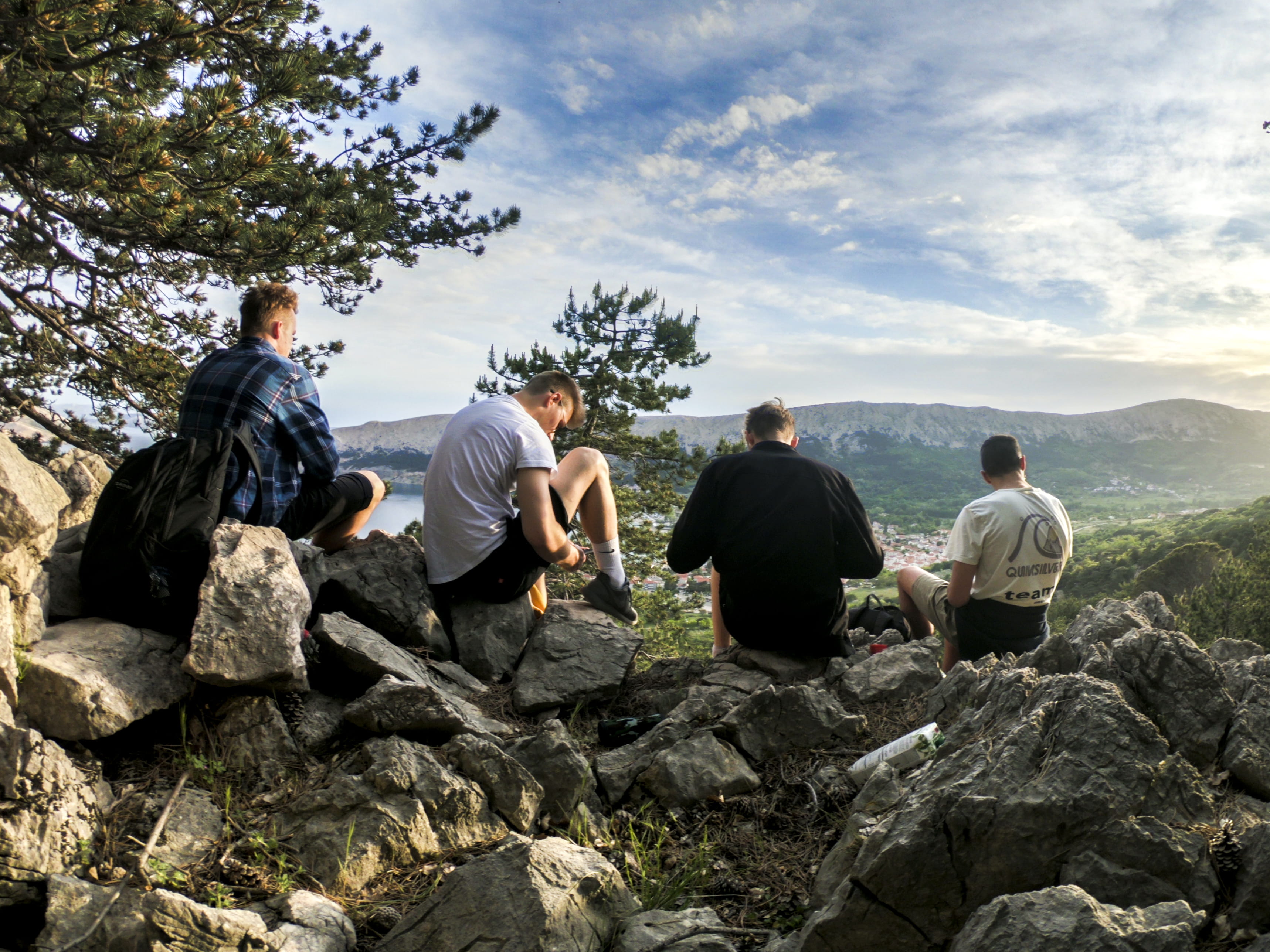 leisure activity, young men, people, green, man, group of people, full length, hill, seated, plant, mountain, real people, hike, rock, cloud - sky, facing, HD Wallpaper