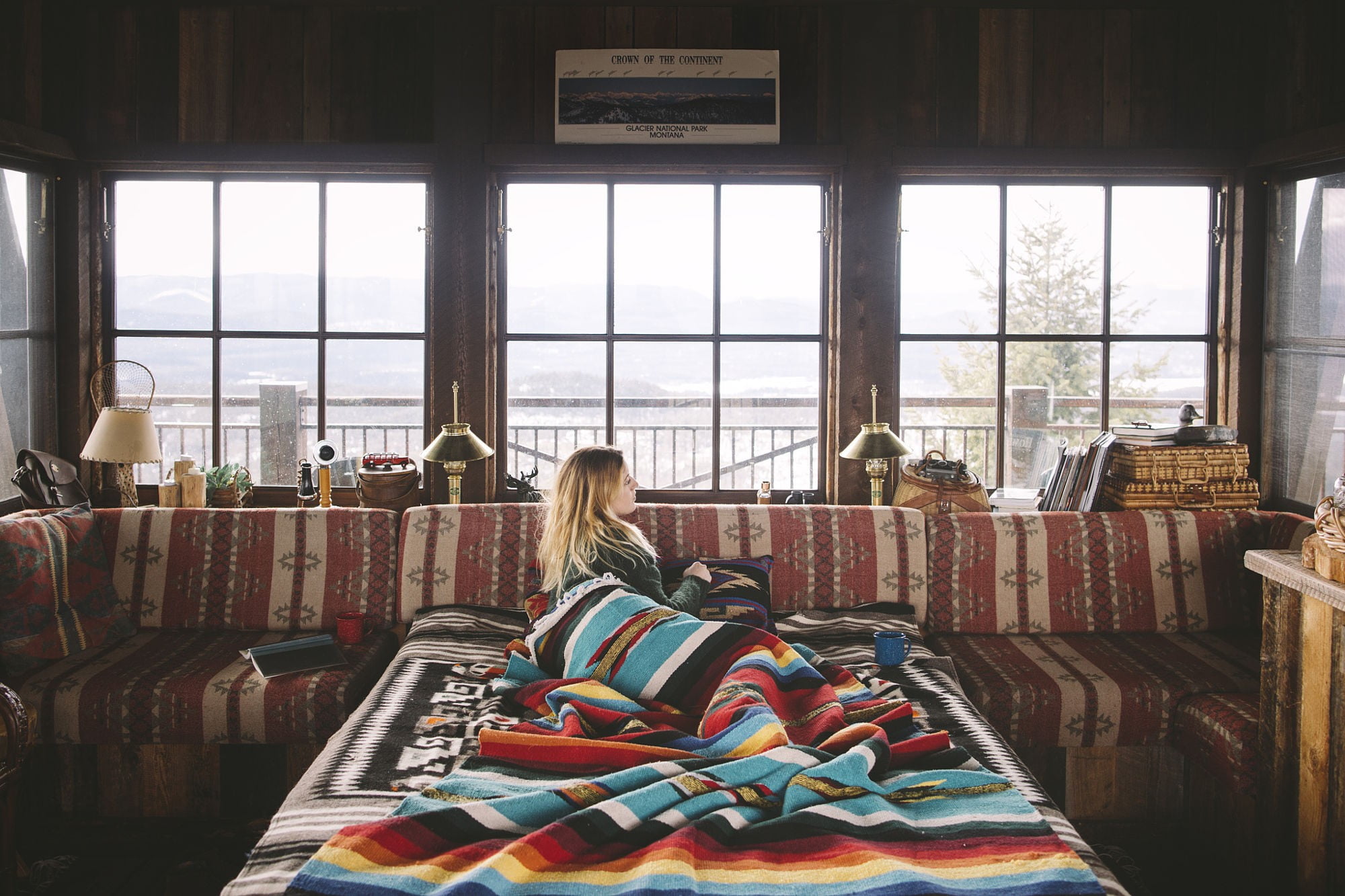 women, blankets, casual clothing, cabin, 1080P, real people, one person, seat, rear view, colorful, indoors, window, hairstyle, snow, domestic room, sitting, HD Wallpaper