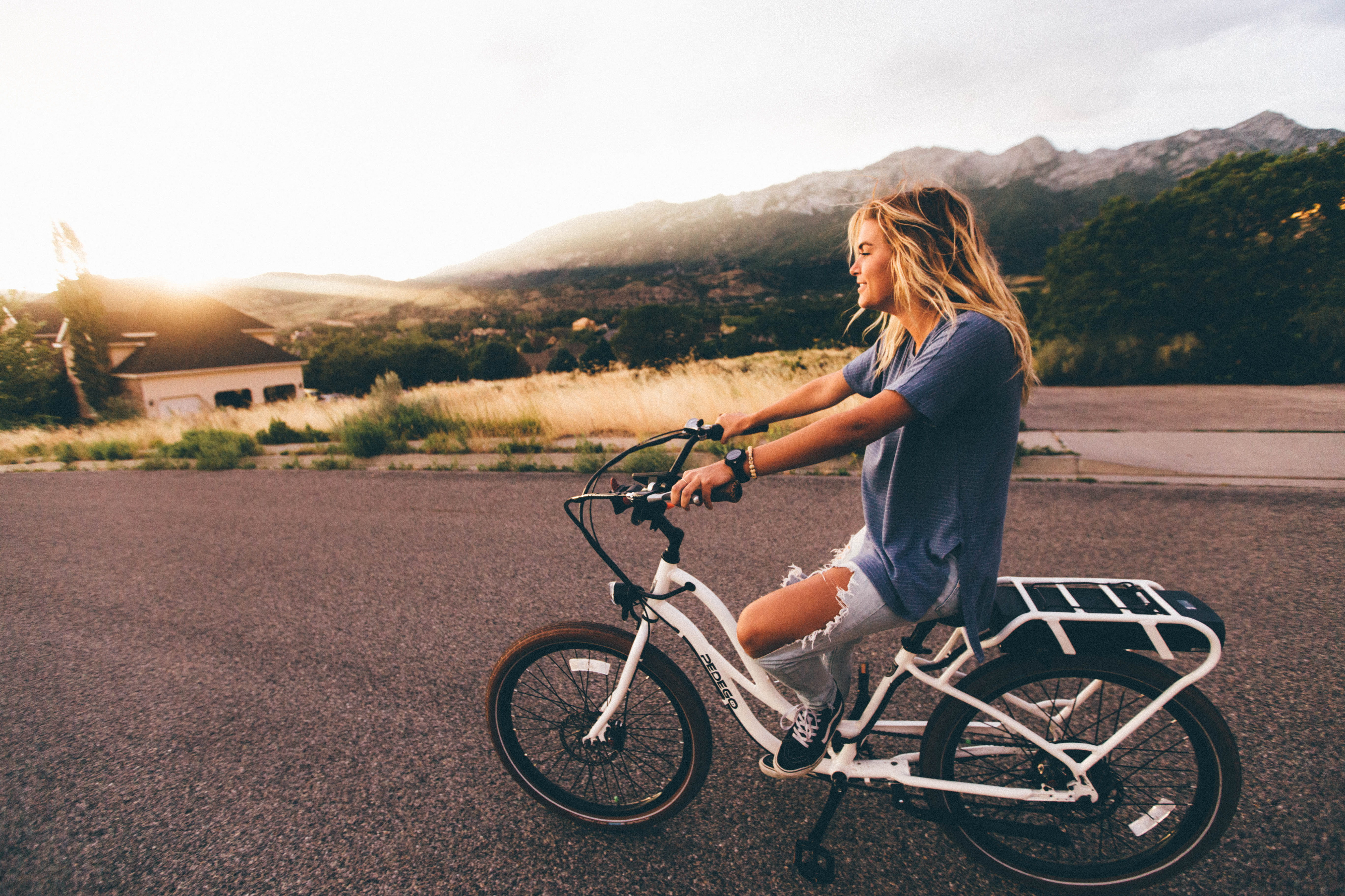 hair, outdoors, blue, denim, girl, one person, distressed, hairstyle, activity, cycling, daytime, jeans, women, near, white, riding, sport, sun, t, leisure activity, HD Wallpaper