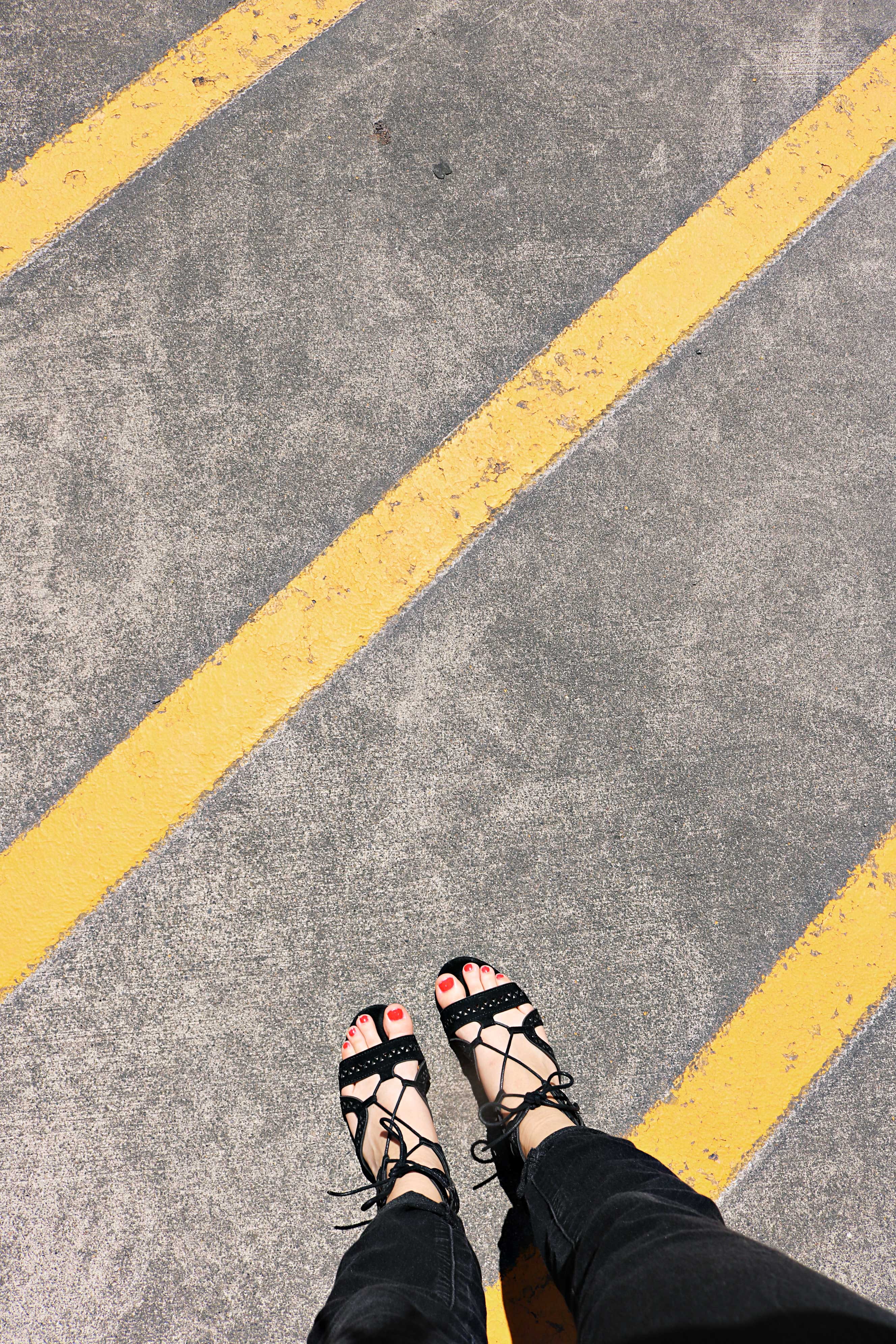 black, cement, person, marking, yellow, pants, shoe, transportation, real people, human body part, symbol, wear, directly above, close-up, one person, red nails, Phone HD Wallpaper