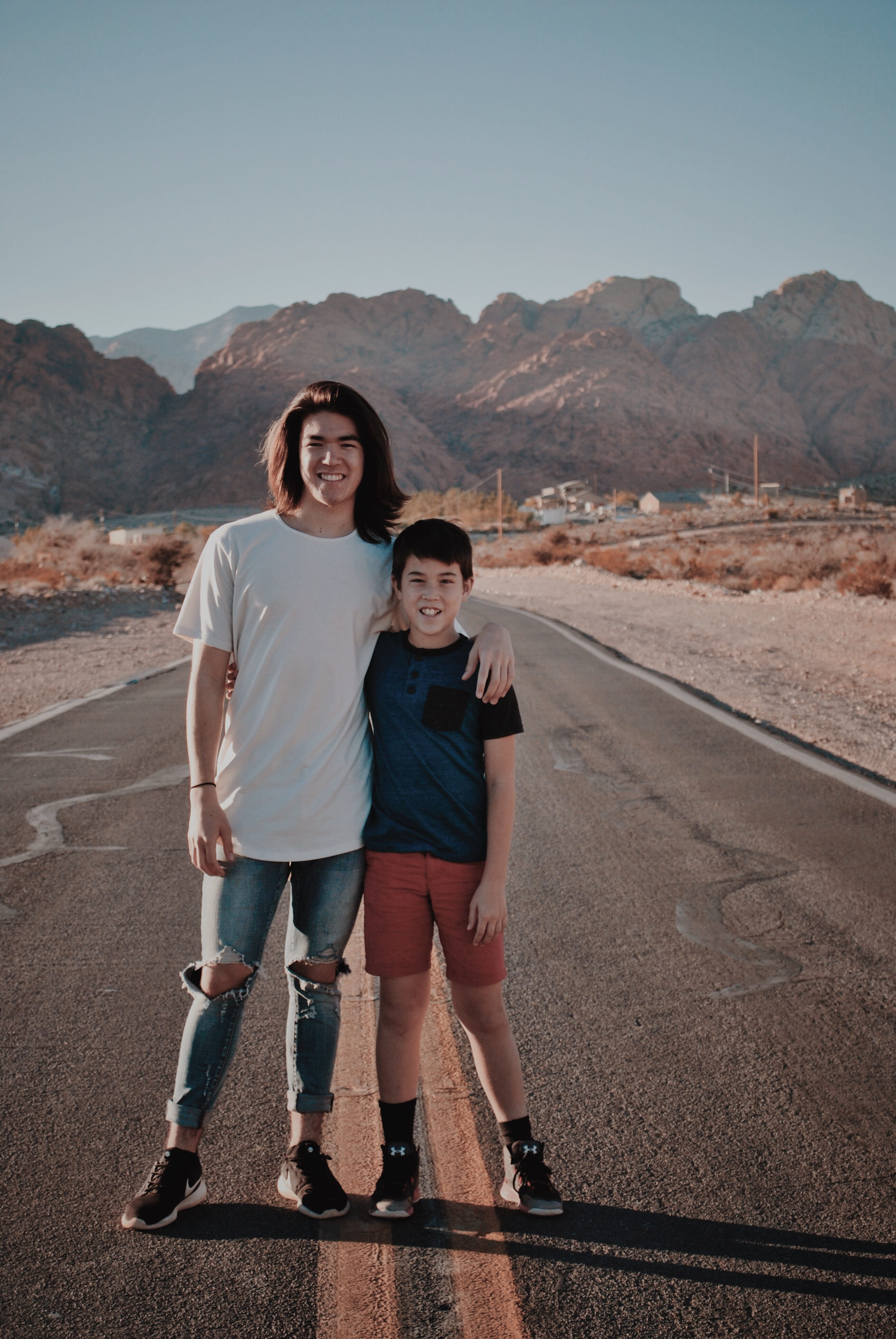 son, ripped, males, t-shirt, two people, mountain, front view, asphalt, footwear, mountain range, smiling, people, person, men, child, long sleeve, way, Phone HD Wallpaper